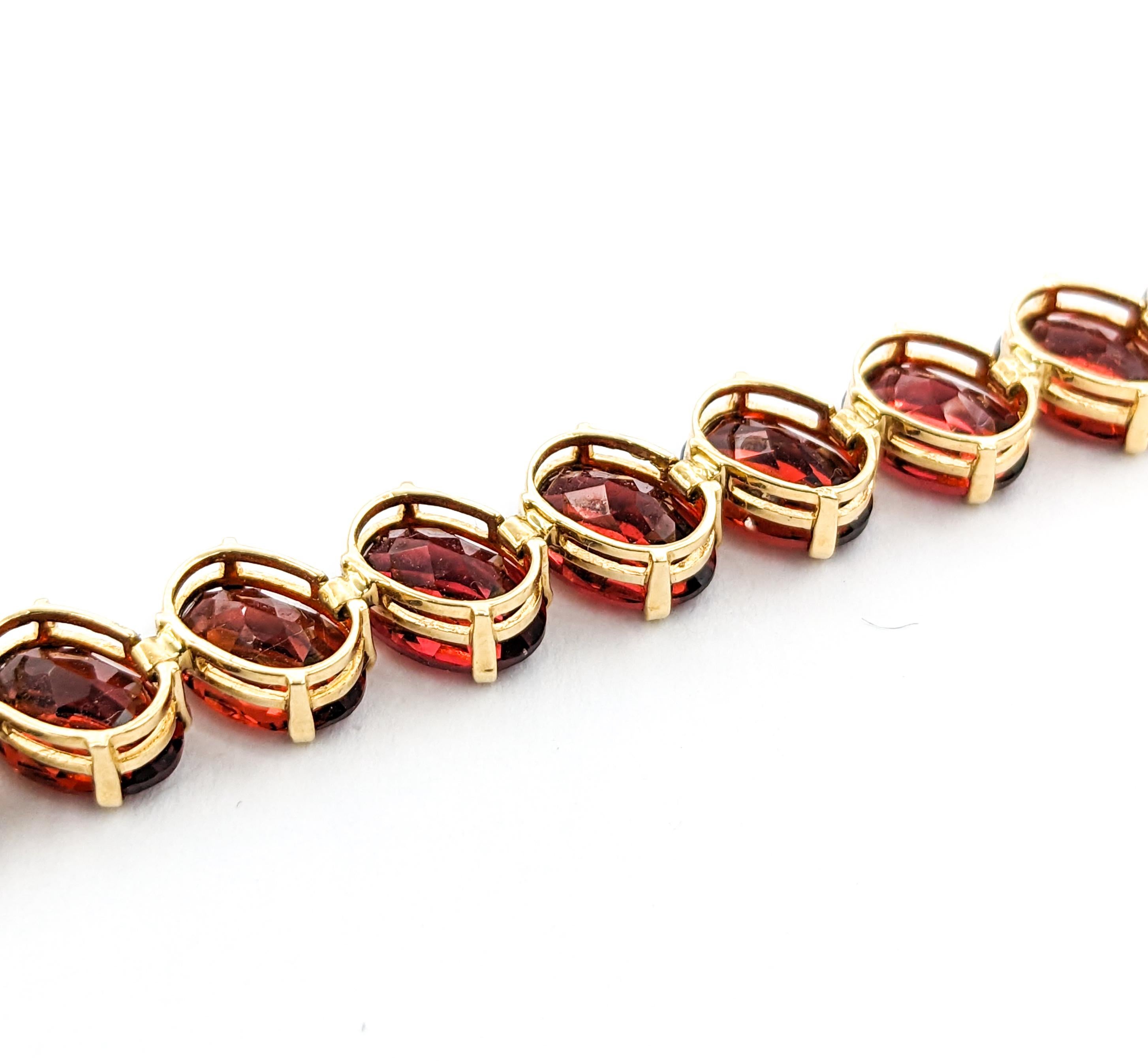 Crimson 26,6ctw Oval Granat-Tennisarmband aus Gelbgold 1