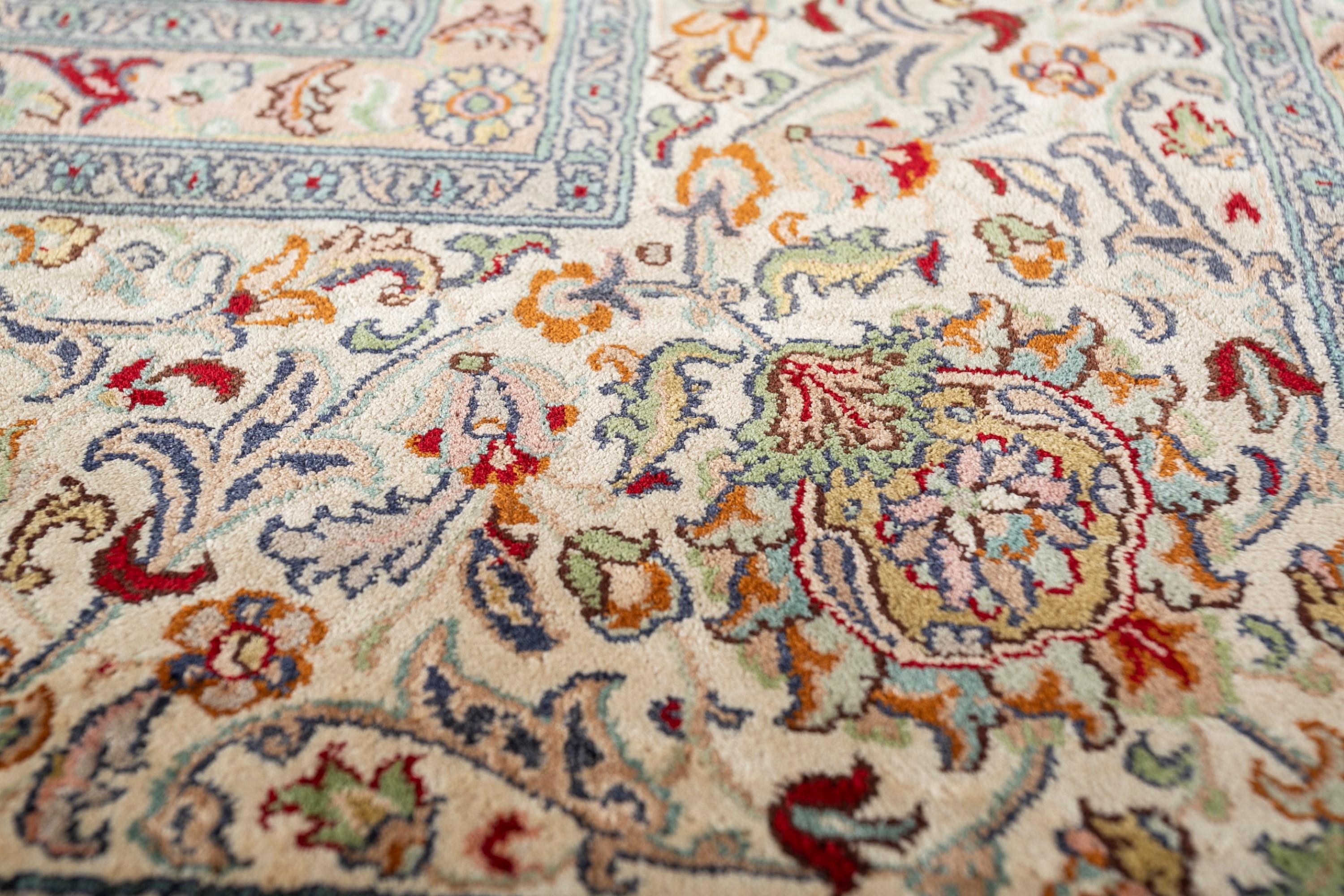 This hand knotted rug from our Gulmarg collection is a visual symphony, where every knot tells a story of skill and artistry. It features a traditional floral pattern that blooms with timeless elegance. Delicate petals and intricate vines intertwine