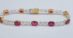 Crimson Majesty - Fine Mozambique Rubies set with Oval Diamonds in 18K Bracelet