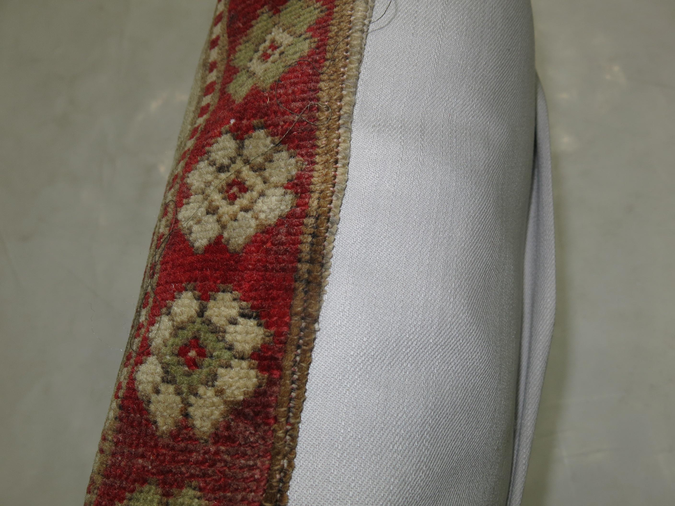 Pillow made from an antique Turkish Sivas rug in camel and crimson red colors.

Measures: 17
