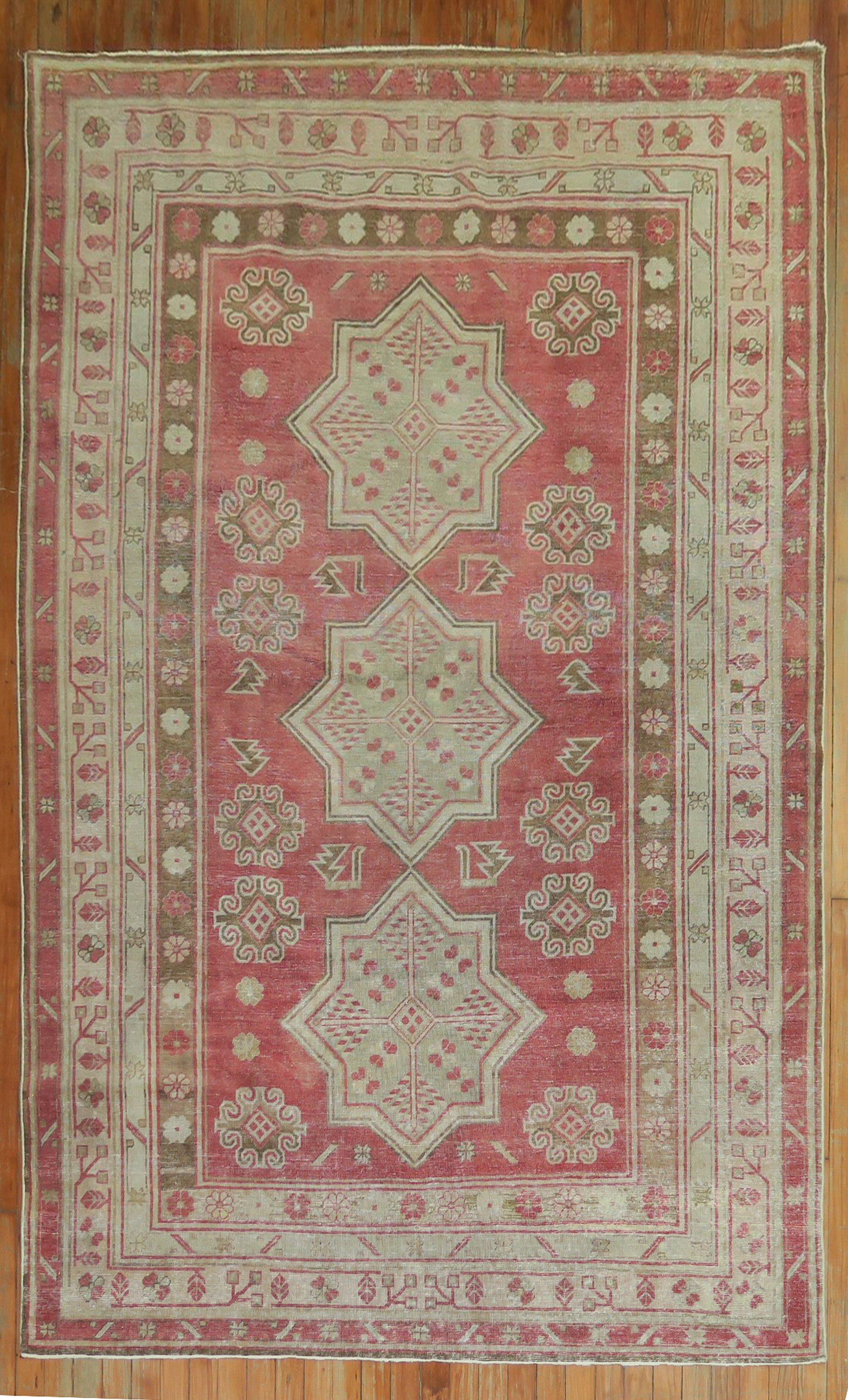 An early 20th century Crimson Red background Samarkand rug, predominant accents in gray-green and brown

Measures: 5'4'' x 8'5''.