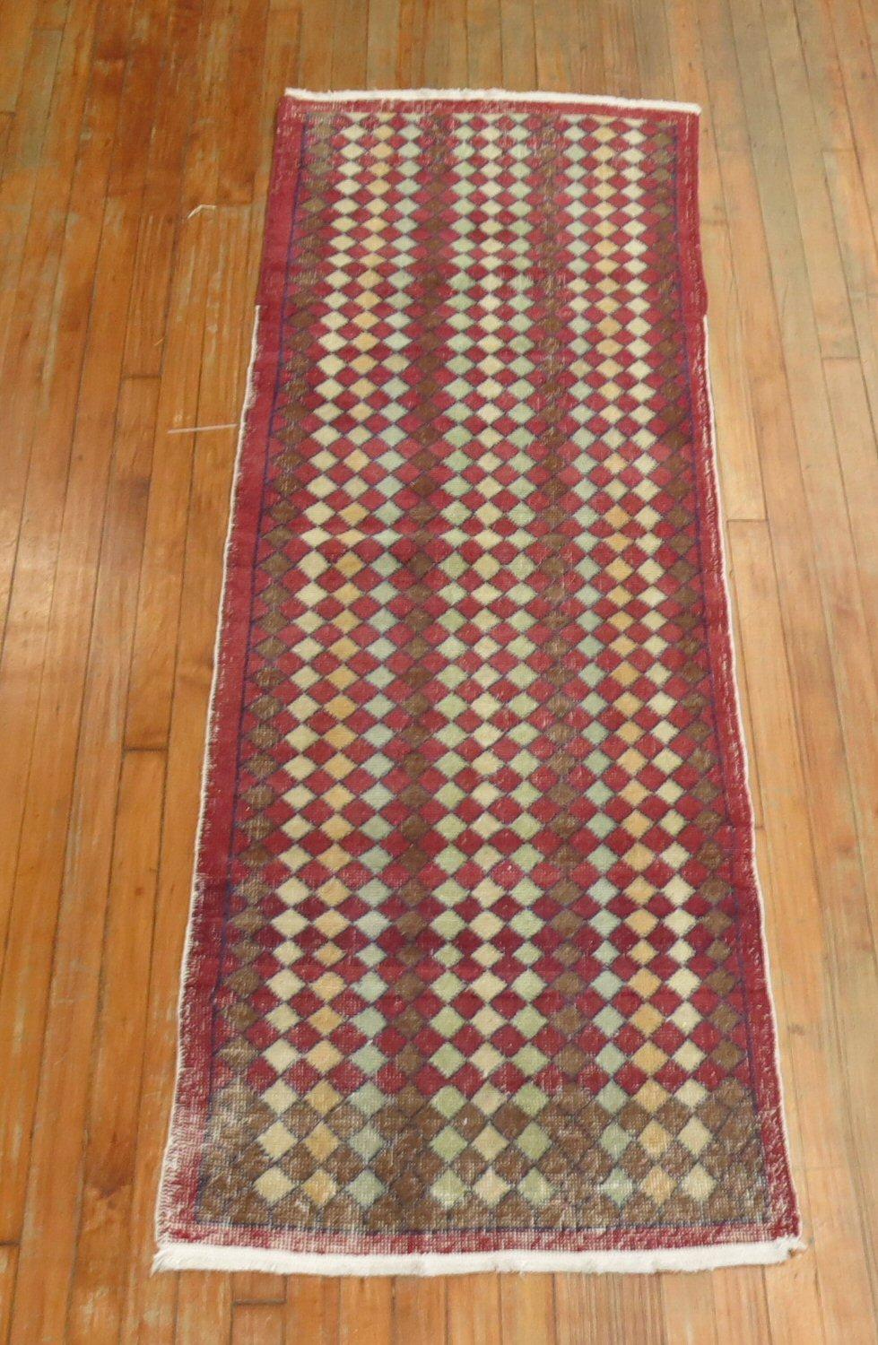 Crimson red Turkish deco runner from the mid-20th century with an all-over repetitive design of small diamonds throughout. So Shic. Shabby chic!