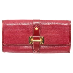 Crimson Suhali leather Louis Vuitton Le Favori wallet with brass hardware