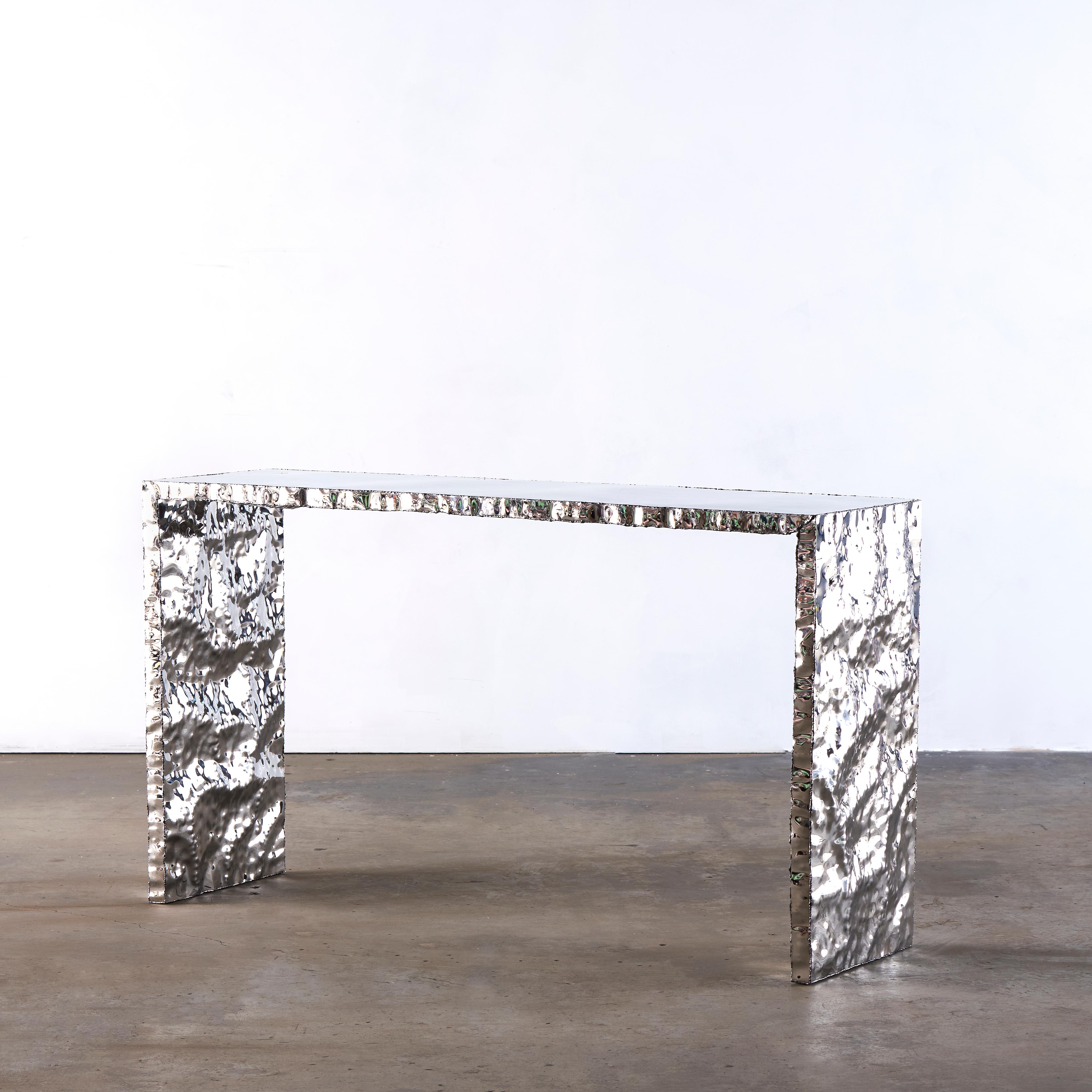 Crinkle console by Michael Gittings Studio
One of a Kind
Dimensions: D 150 x W 40 x H 81 cm
Materials: Mirror polished stainless steel

Michael Gittings
Melbourne based designer Michael Gittings aims to
Challenge pre-conceptions around