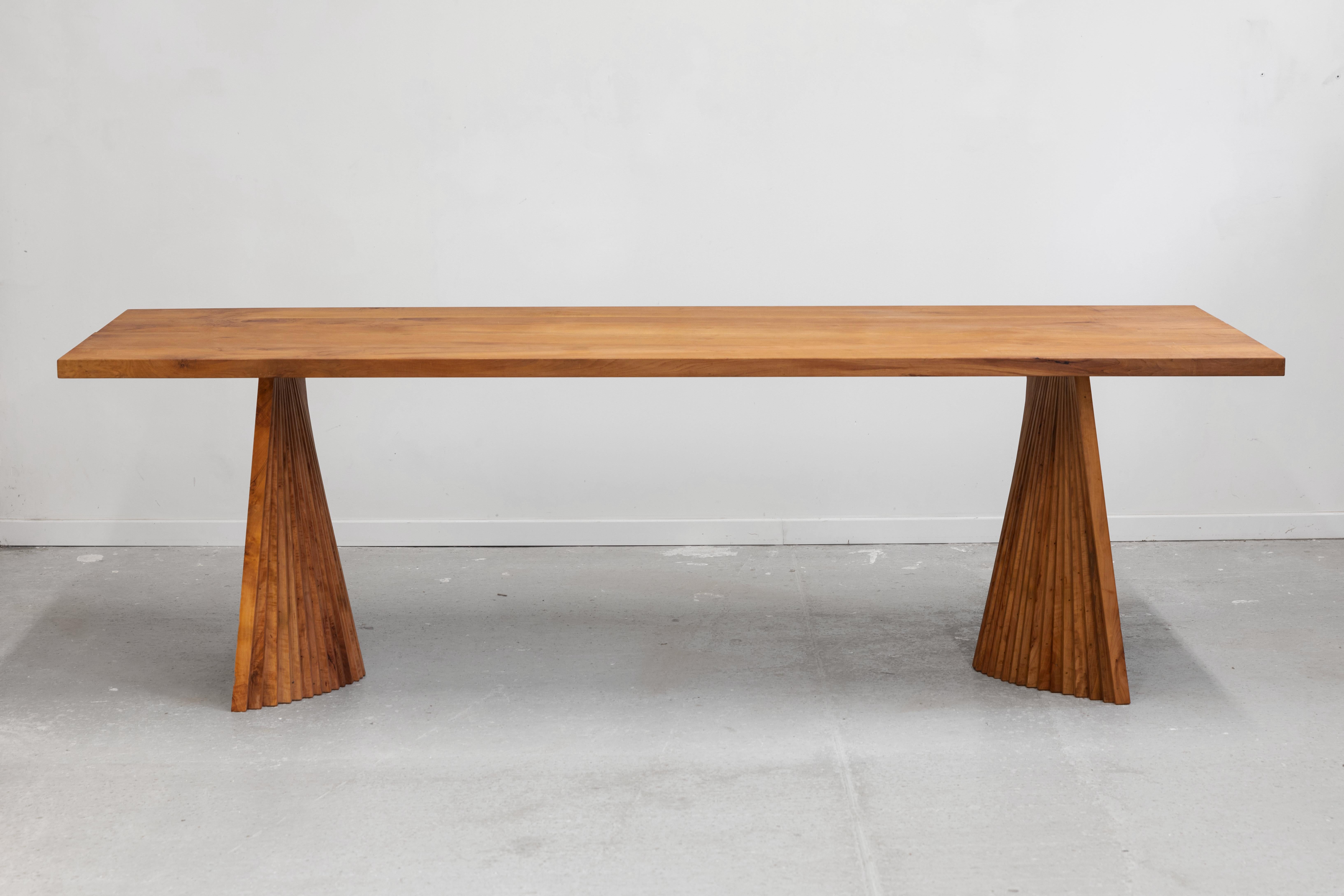 Crinkle Crankle Table by Dirk Meylaerts
Dimensions: W 85 x D 210 x H 74 cm
Materials: Pearwood.

To efficiently generate a volume using a minimal amount of material, I employ the concept akin to the British “crinkle crankle” wall technique, in which