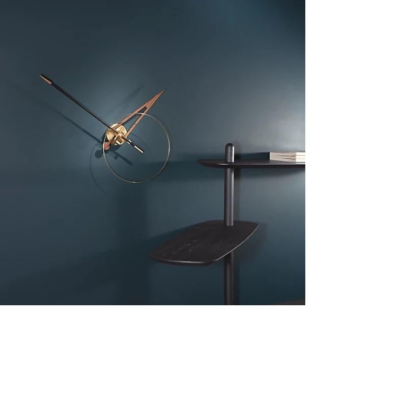 The Cris G is a handmade clock that combines emotive aesthetic with strong impact. The design incorporates contrasting materials, such as brass, walnut and fiberglass. The minute hand is available in black fiberglass and the minute hand in walnut