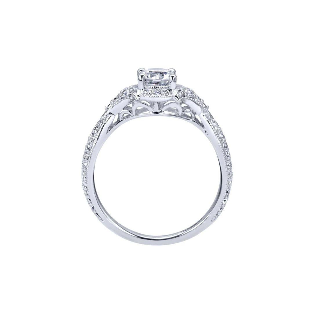 Ladies' Criss Crossed 14k White Gold Diamond Engagement Ring. Milgrain, diamond pave and a soft woven criss cross give this ring a romantic look with a touch of vintage nostalgia. Center certified diamond is included, 0.46 ct. Side diamonds are 0.42