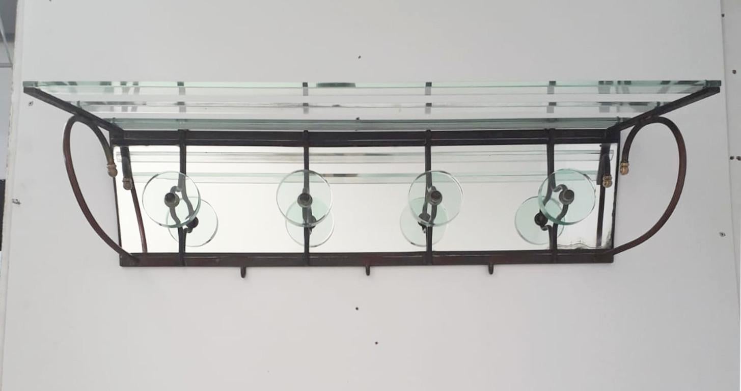 Vintage coat rack with thick beveled glass and brass frame / Made in Italy by Cristal Art circa 1960s
Length: 37.5 inches / depth: 10 inches / depth: 9 inches
1 in stock in Italy
Order reference #: FABIOLTD F160