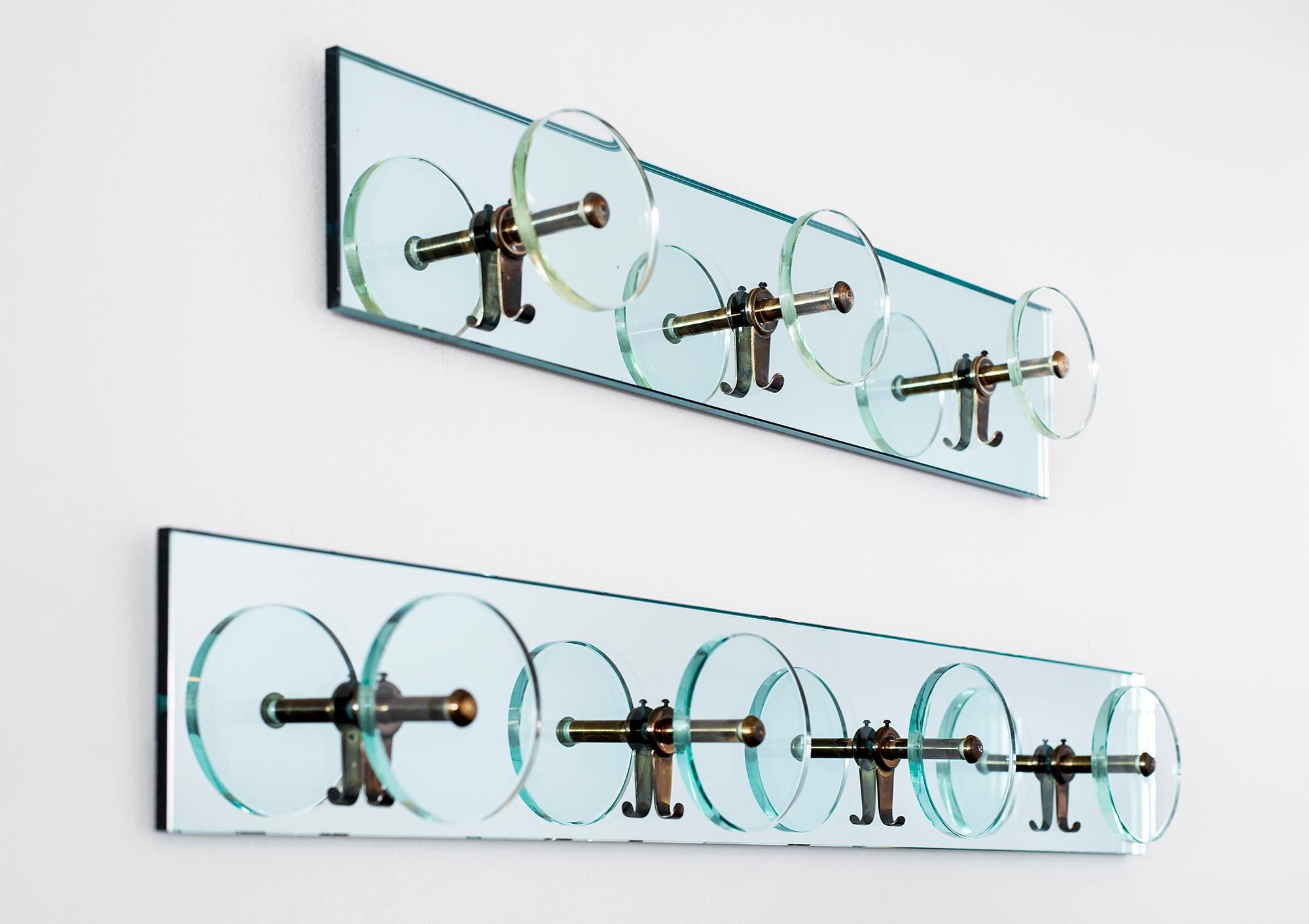 Italian glass coatracks by Cristal Art.
Glass circular discus with brass hardware mounted on mirror. 

Sold and priced individually. 

Smaller size - 27.75