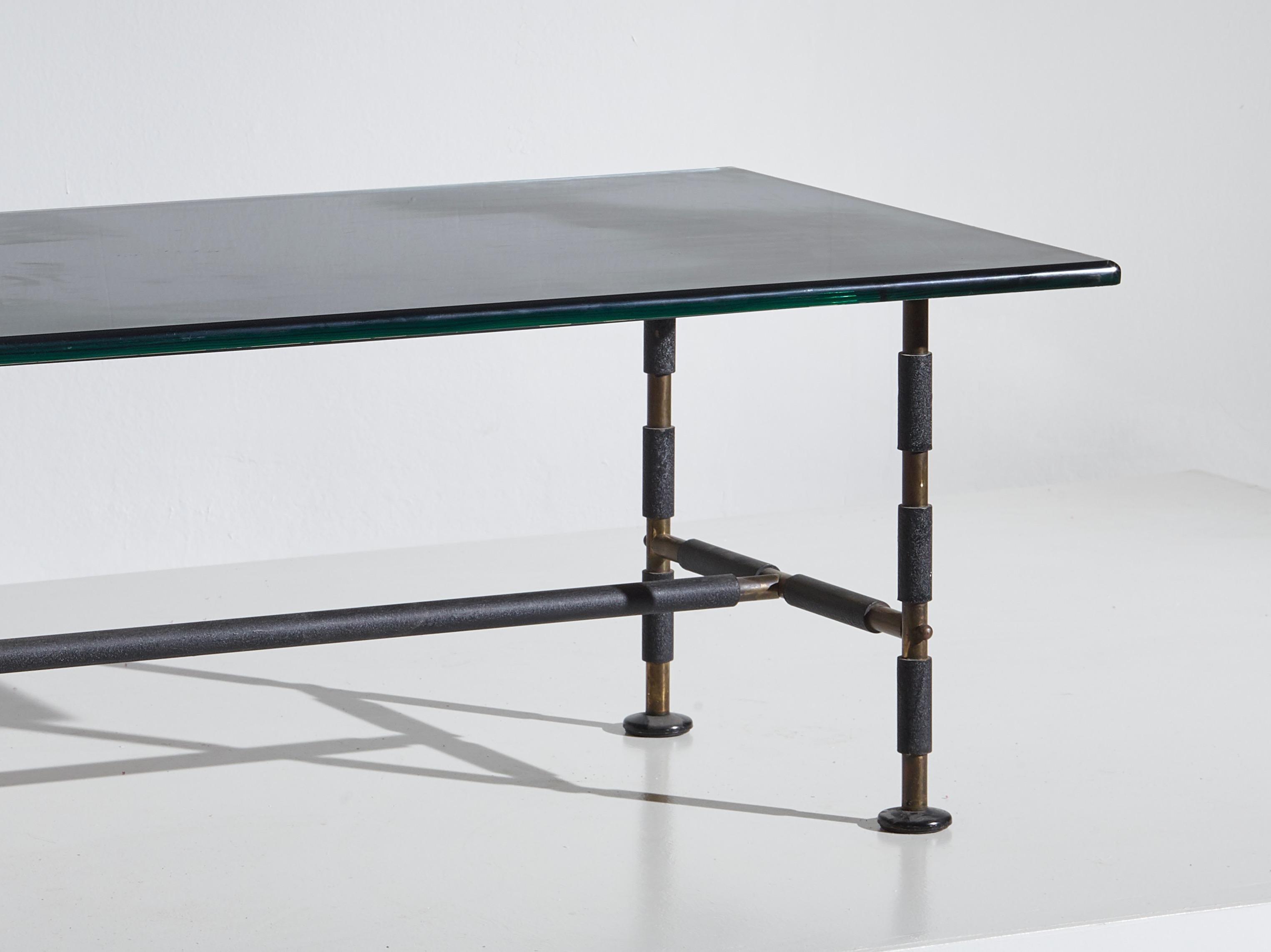 A beautiful occasional table mod 2661 designed and manufactured by Cristal Art in the 1960’s with a polished brass and lacquered metal structure and a mirrored glass top with rounded borders.

Dimensions: 102 x 60 x 42cm [DxWxH]

Condition: Good