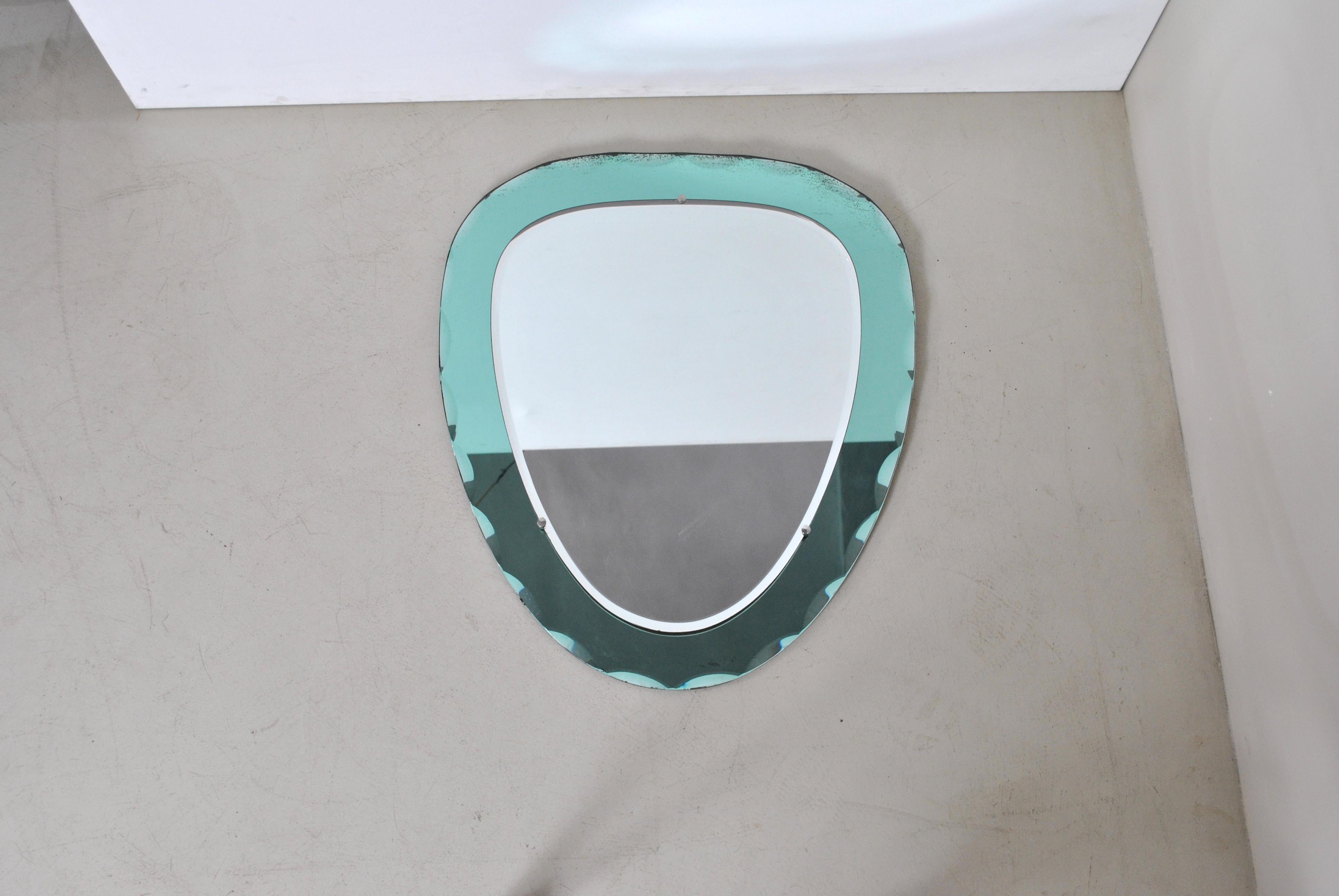 1950s mirror, circumference ground glass and colored in sea water green Italian production Cristal Art.