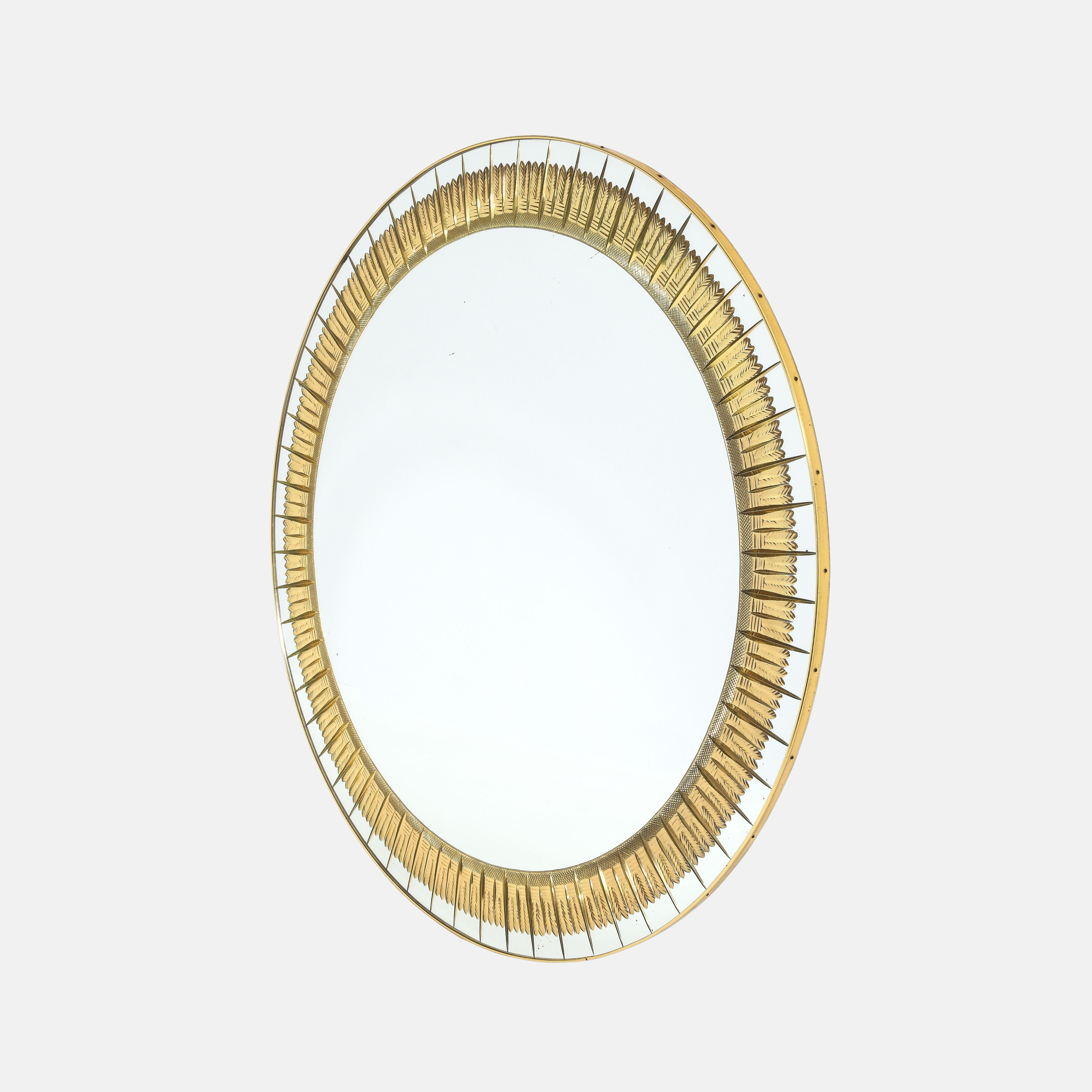 Cristal Art rare large round intricately engraved and gilded pressed glass wall mirror, Italy, 1960s.  This exquisite mirror has a lovely mirrored glass border composed of a beautifully designed Bohemian-type pattern with scroll-engraved and gilded