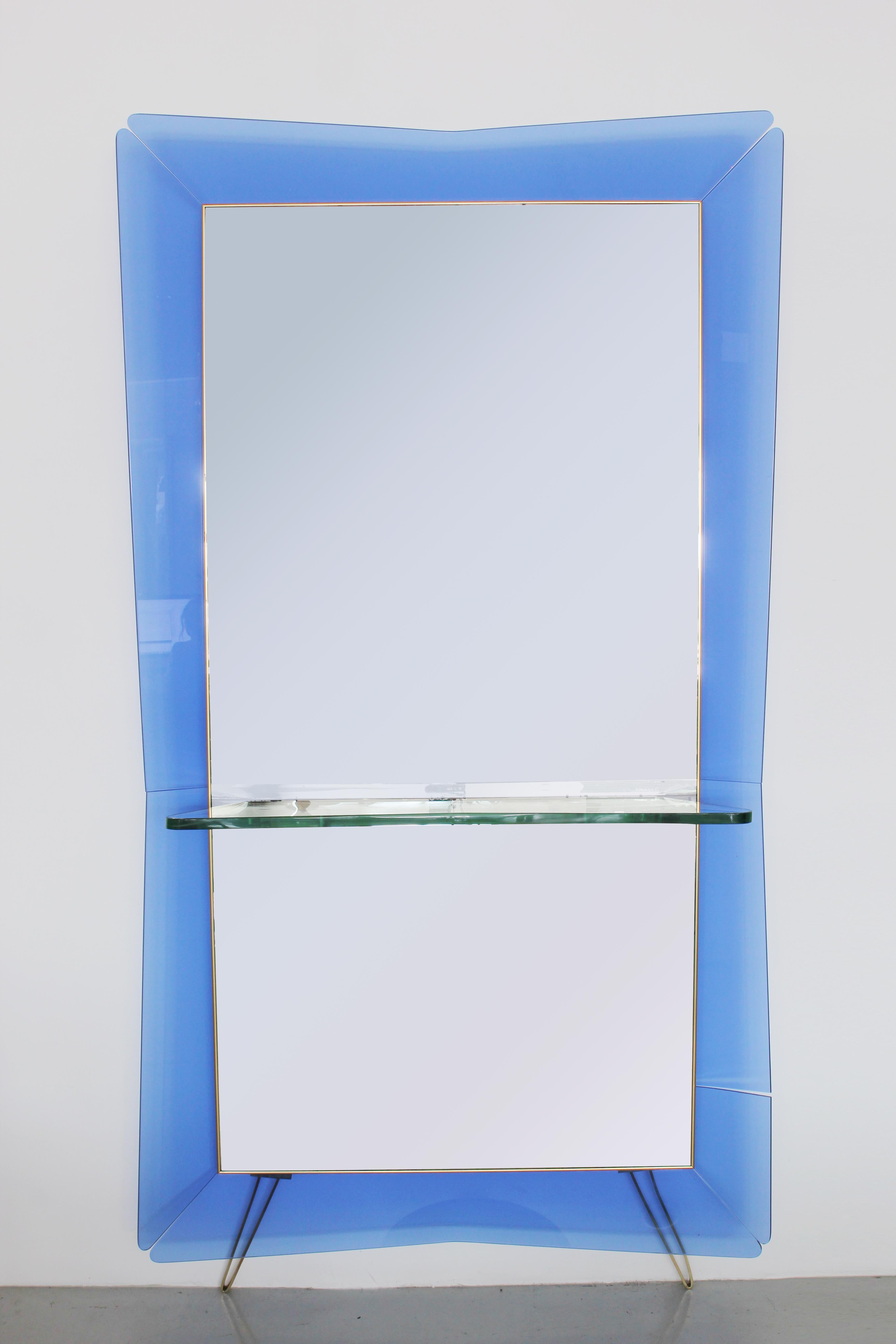 Giant Cristal Art mirror with blue frame and glass console.