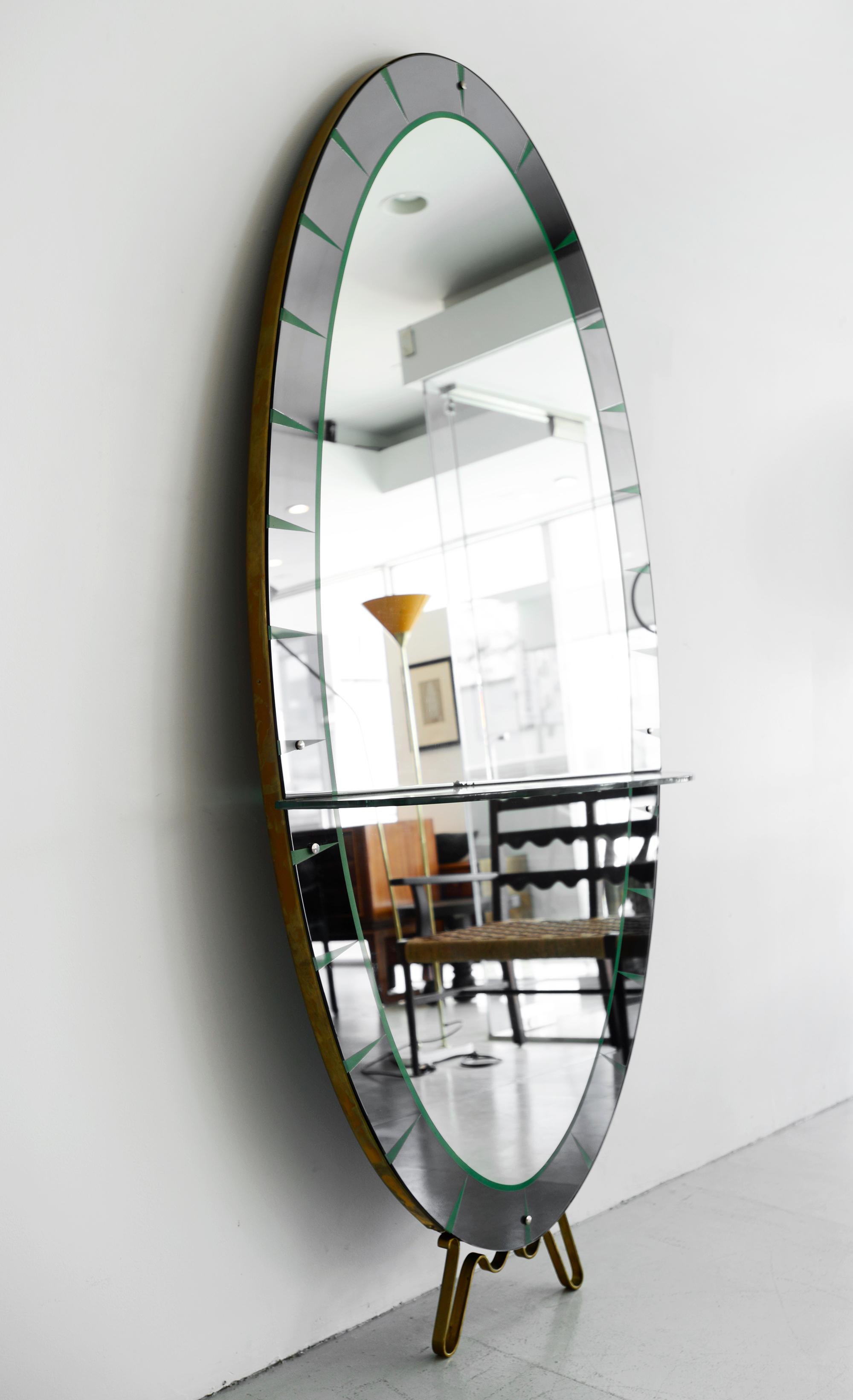 Cristal art mirror with glass shelf, green etched detail, and brass.