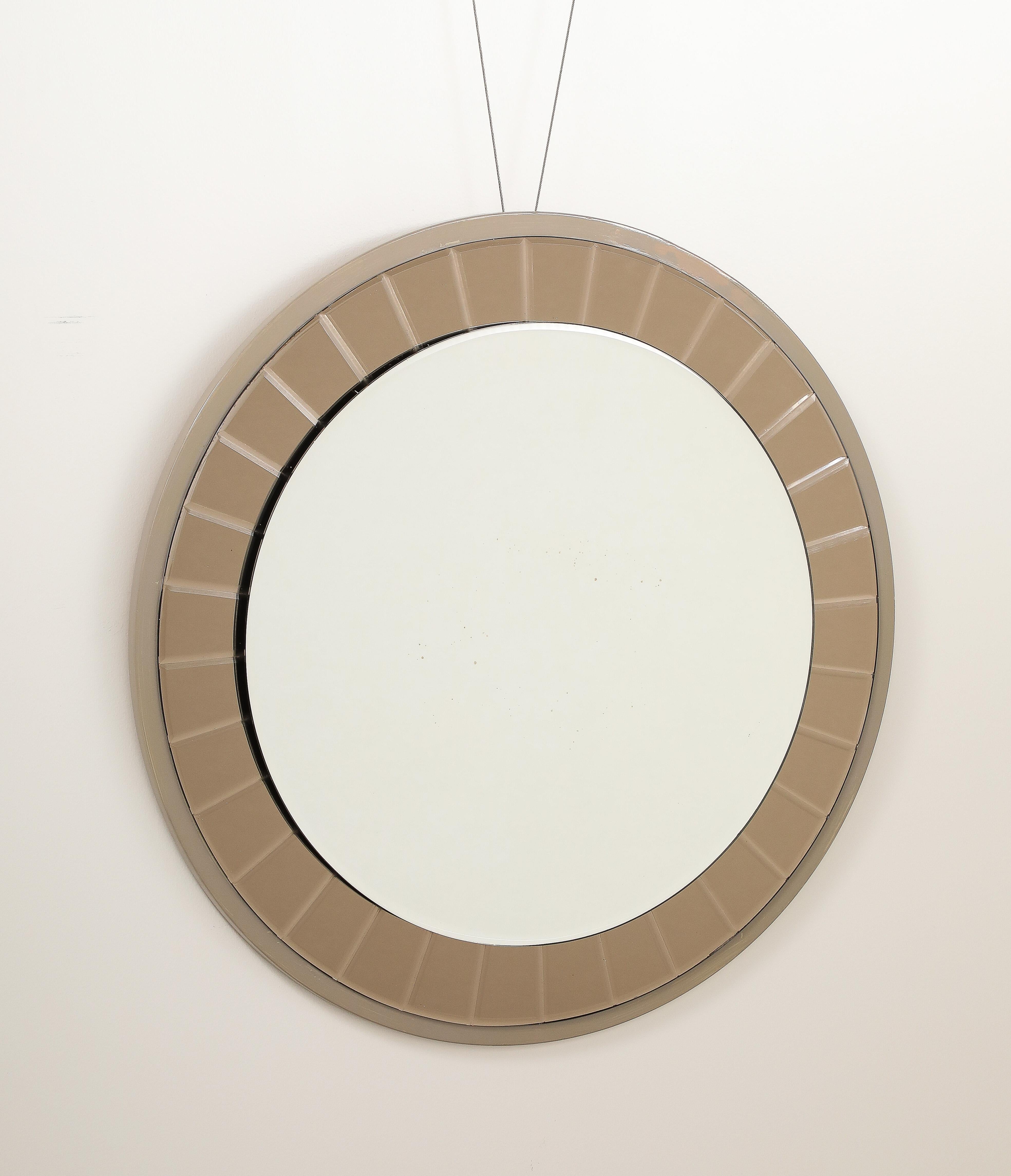 The circular form with hand-crafted beveled or faceted crystal glass pieces framed by a painted grey wood outer molding. The faceted glass pieces are realized in a stunning electrifying steel grey color. This design model is a classic example of the