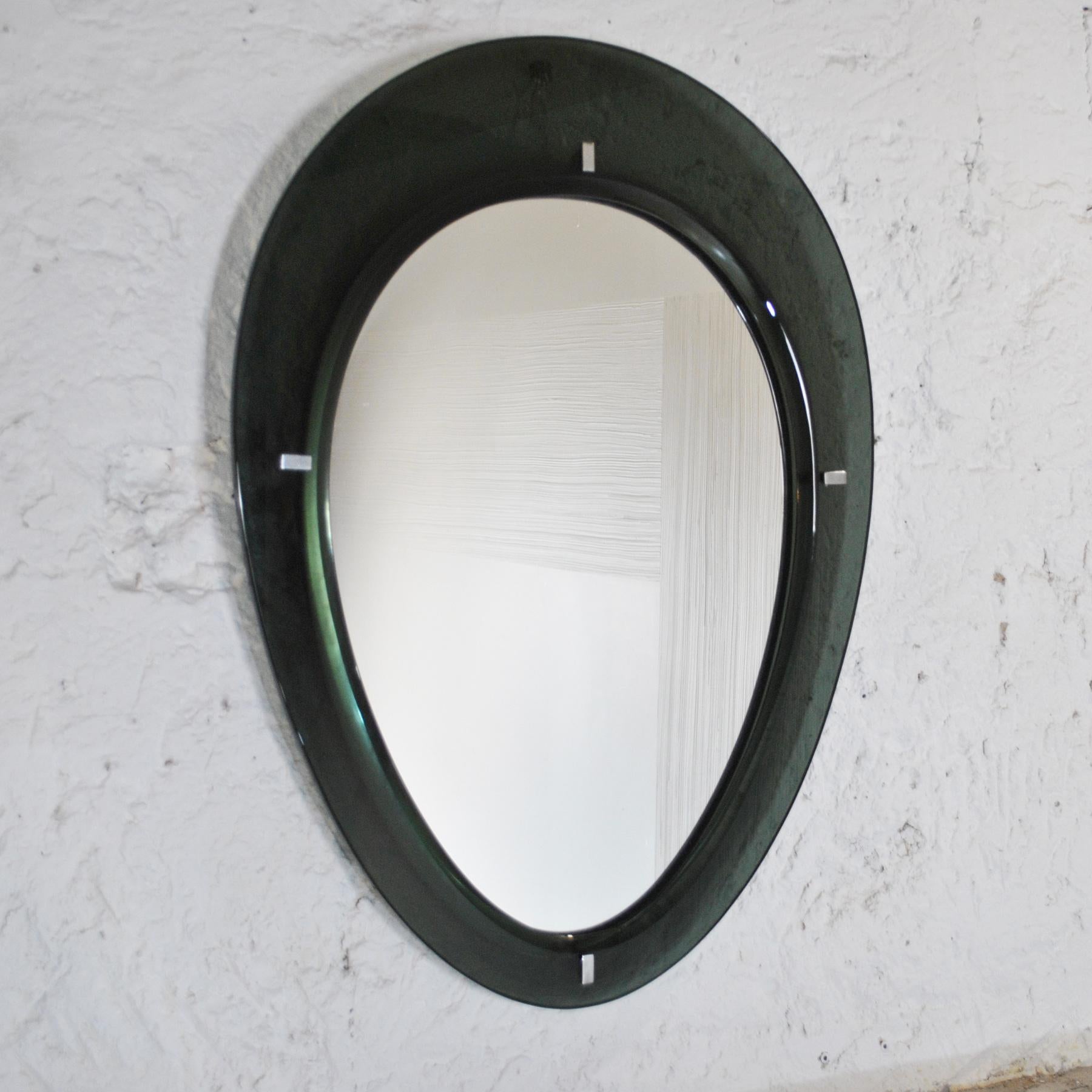 Superb mirror from the 50s, rounded and thick glass circumference in wood color, Italian production Cristal Art.