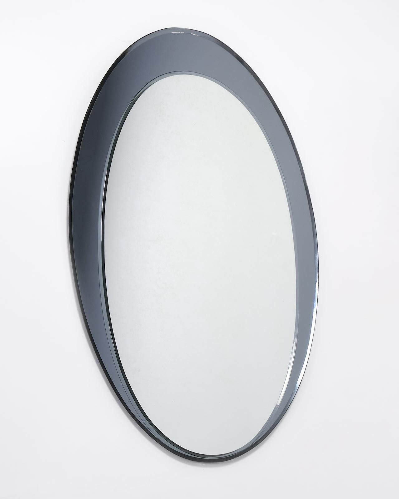 c.1960s
Laiton et verre biseauté foncé
H90 x L61 cm x P4cm