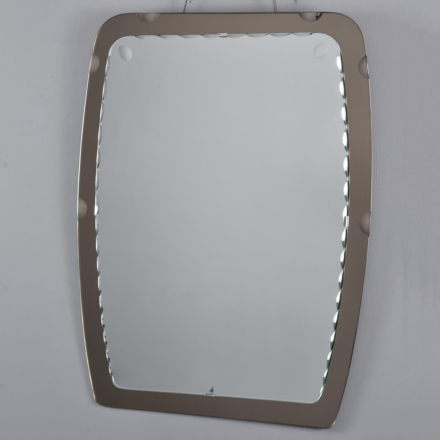 Italian mirror by crystal Arte has a rectangular shape with rounded corners, a scallop edge mirror with smoky gray art glass frame, circa 1970s. Metal hanger on the back.