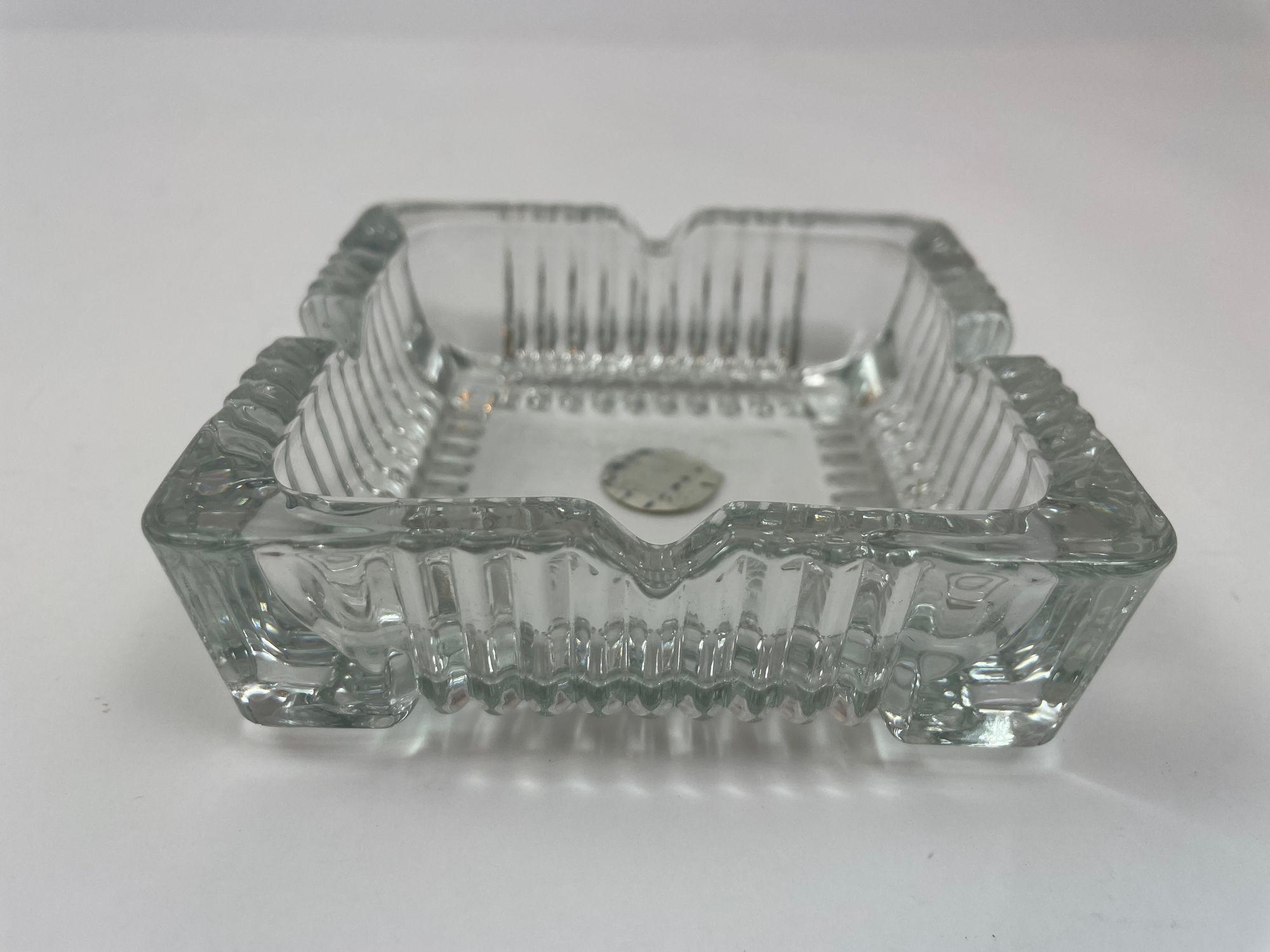 Vintage Clear Cristal D'Arques Crystal Ashtray Trinket Dish France Cut Glass Square Catchall.
Large thick cut glass square glass ashtray with beautiful detailed glasswork offering 4 spaces to hold your smoking item.
Cristal D'Arques, Made in France