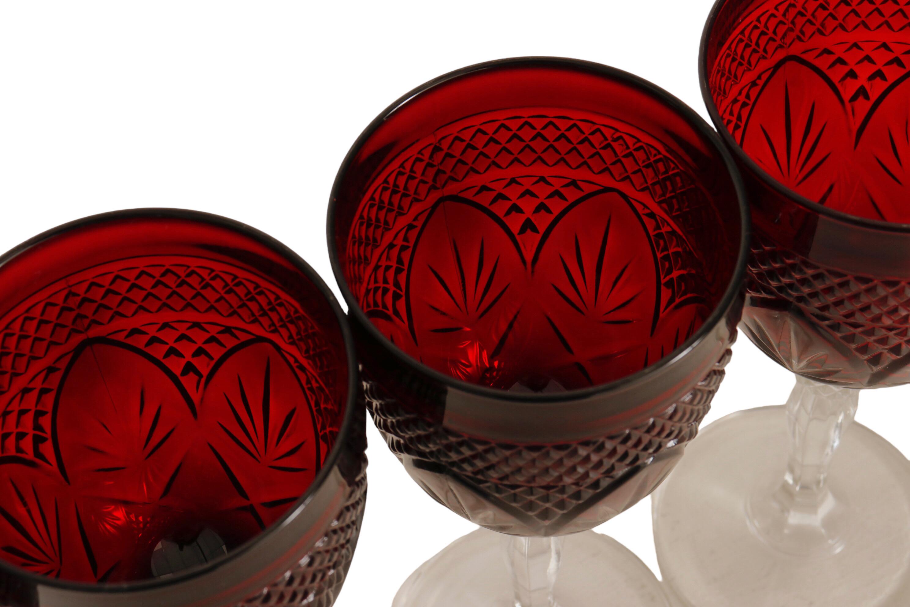 A set of six French ‘Antique Ruby’ wine glasses by Cristal D'Arques-Durand. Pressed cut with a ruby red colored vase above a clear stem. Dimensions per glass.
