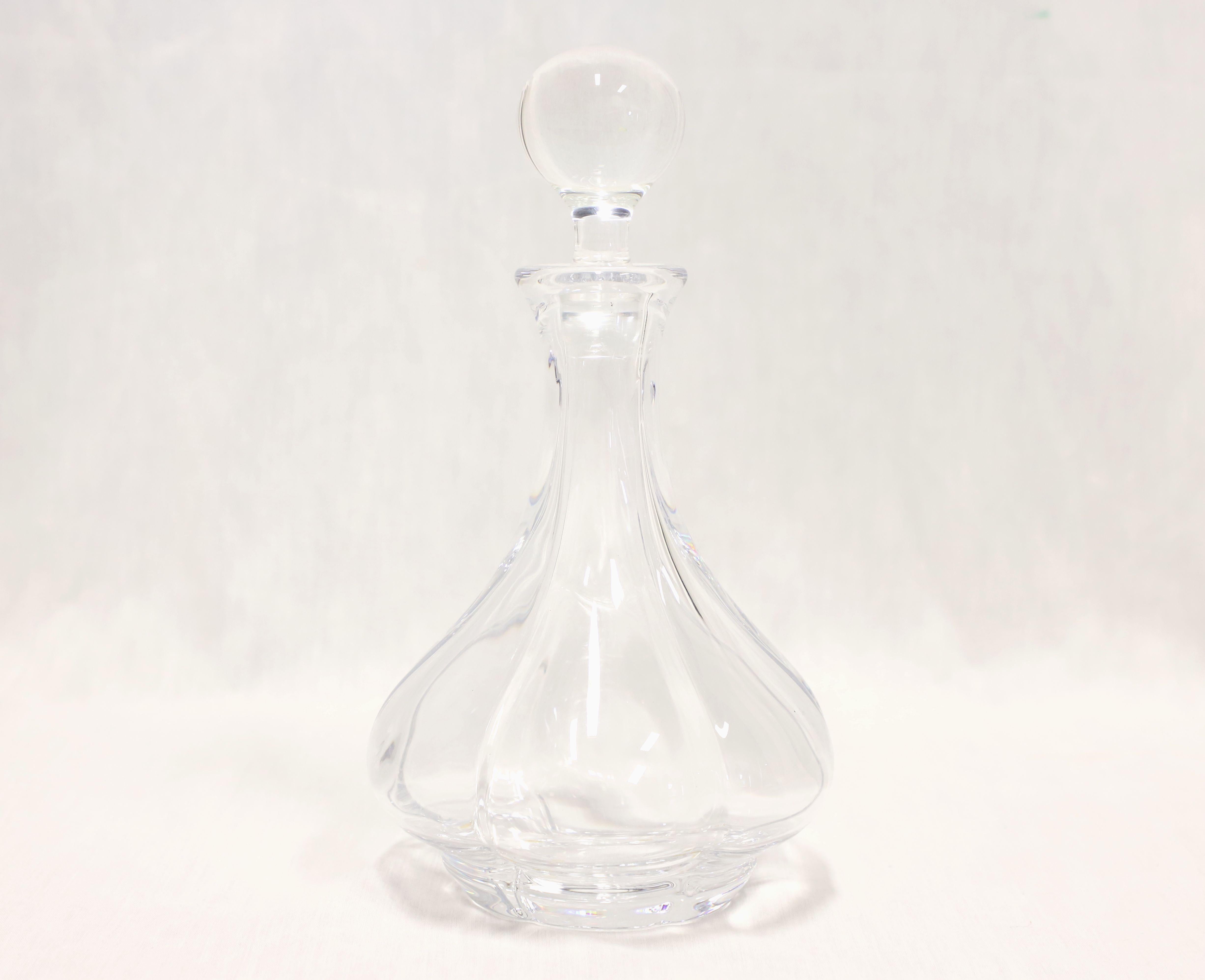 A Late 20th Century fine crystal decanter by Cristal De Serves. Clear crystal decanter with swirl pattern and footed. Clear crystal round stopper. Made in Sevres, France.

Measures:  6w 6d 8h, Weighs Approximately:  5 lbs

Outstanding condition with