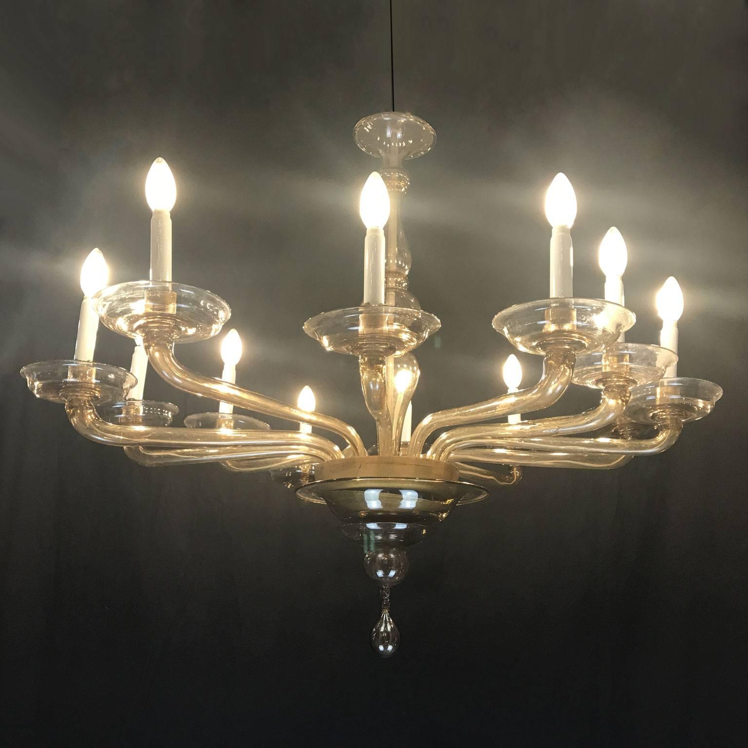 A Cristalleria Murano by Giuseppe Toso Murano blown glass chandelier, a 1940s Venetian Murano smoked blown glass twelve-light chandelier, marked in the large central cup with the rooster brand by Cristalleria Murano. See picture detail.

Located in