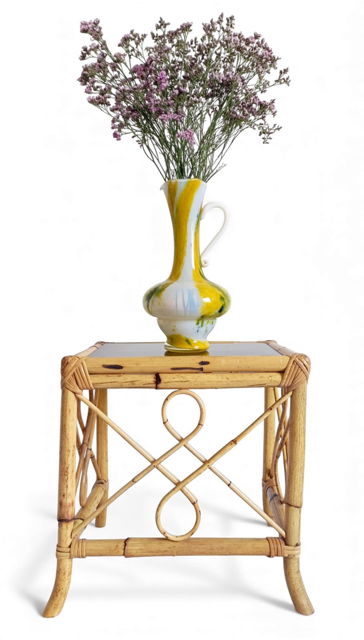 Cristallerie de Clichy White Opaline Pitcher Vase, Early 20th Century

Handmade in France in the early 20th century, this white opaline pitcher vase by Cristallerie de Clichy is crafted from handblown opal glass with primrose-yellow bands and dark