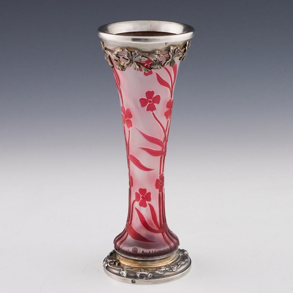 Cristallerie de Pantin Early Acid Cameo Vase with Silver Mounts, c1890

Additional information:
Date :  c1890
Origin : Paris, France
Bowl Features : Tall, slender plants with four-petalled flowers and prominent flag-leaves in magenta over clear