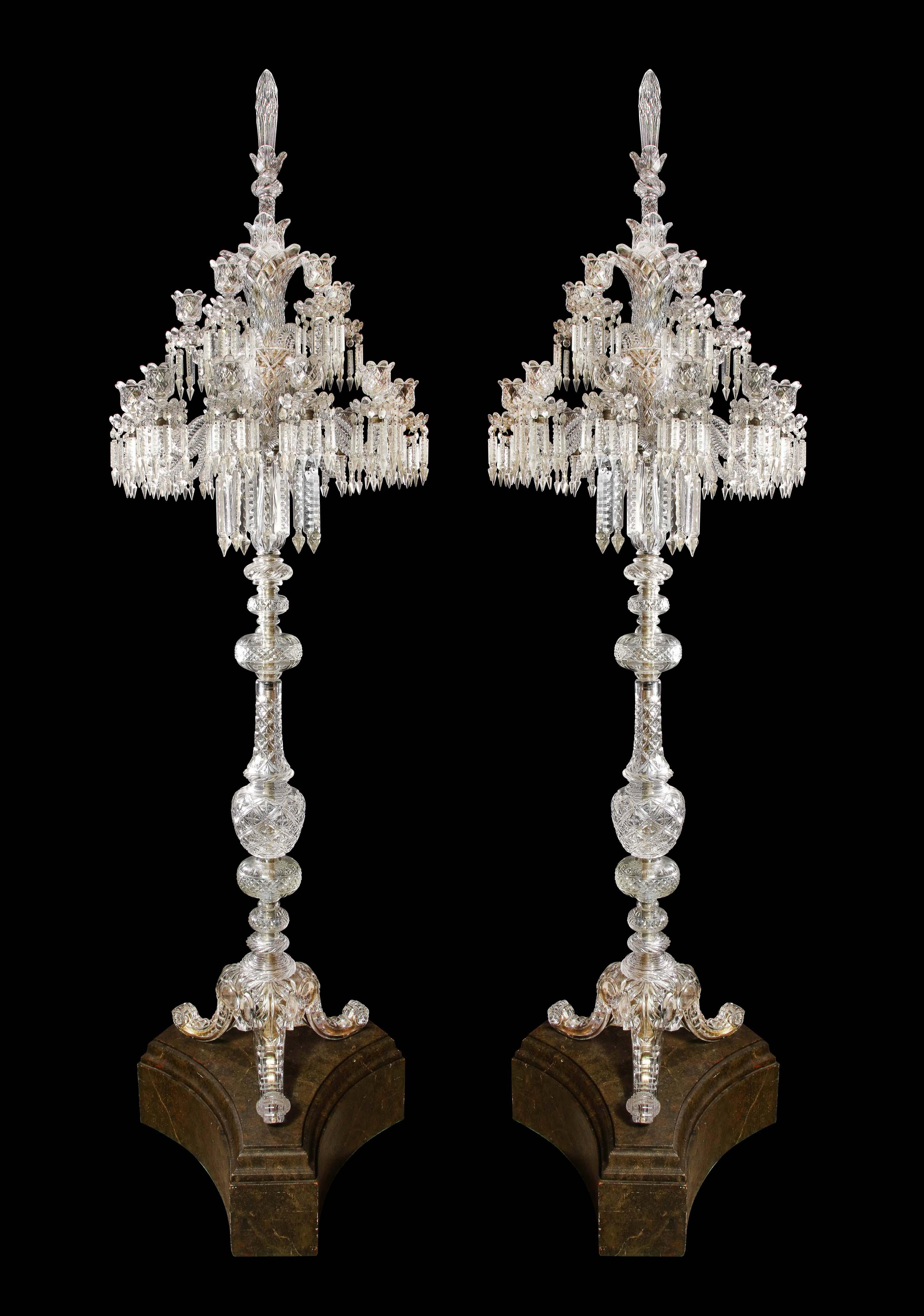 Cristalleries De Baccarat, a large pair of French cut-crystal eighteen light torcheres, early 20th century.

These are extremely rare and unique standing floor chandeliers by Baccarat, Paris.

Each central stem issuing eighteen out-scrolled