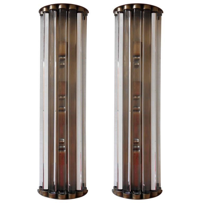 Italian wall light or flush mount with long crystal bars mounted on bronzed metal finish / Designed by Fabio Bergomi for Fabio Ltd / Made in Italy
4 lights / E12 or E14 type / max 40W each
Measures: Height 28 inches / Width 8 inches / Depth 4 inches