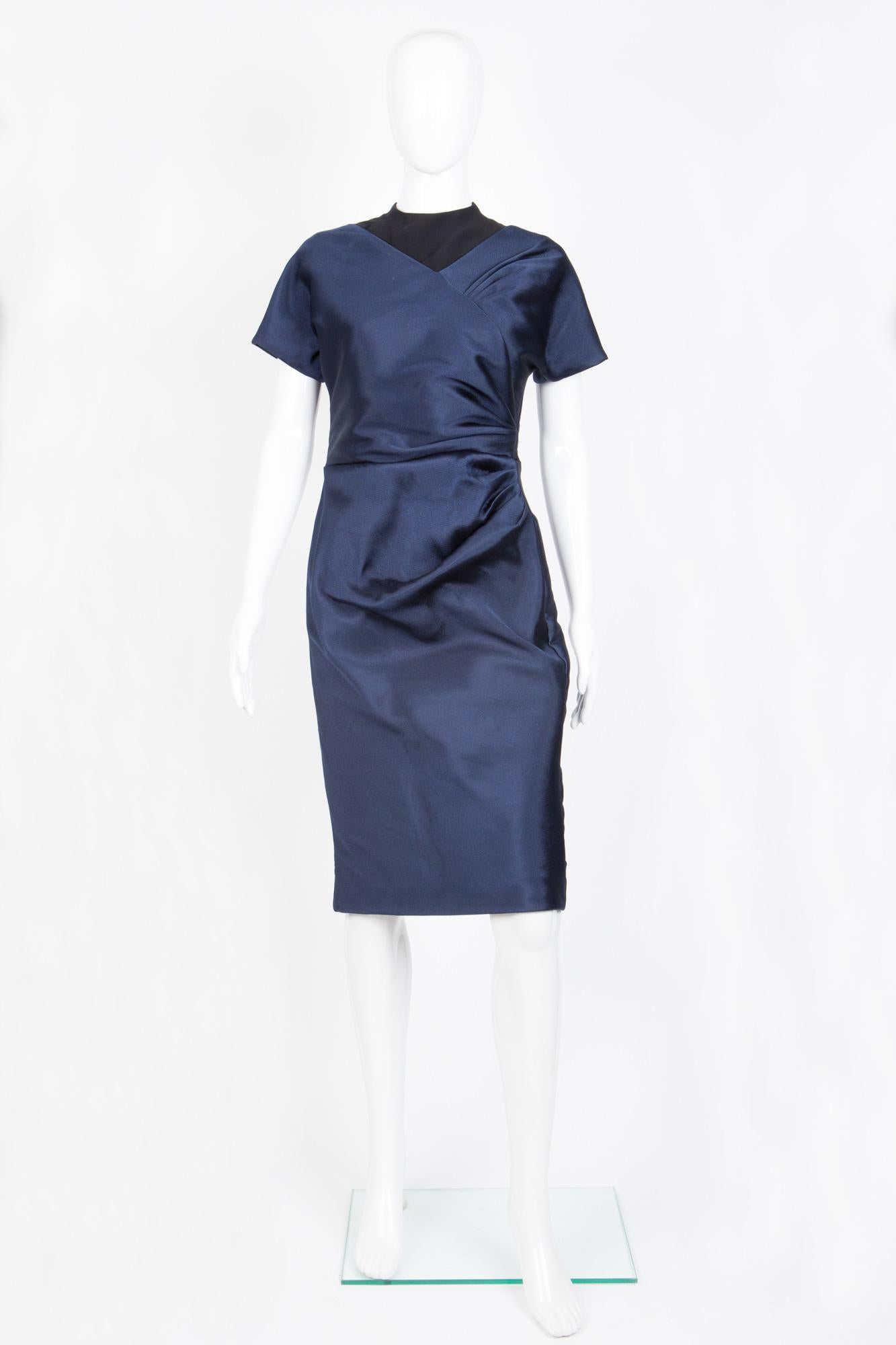 Cristian Dior blue & black cocktail dress featuring a pleated side details, a back zip opening, short sleeves a silk lining. 
57% Polyester,  43% Silk 
In excellent vintage condition. 
Label Size 40fr/US8/UK12
We guarantee you will receive this