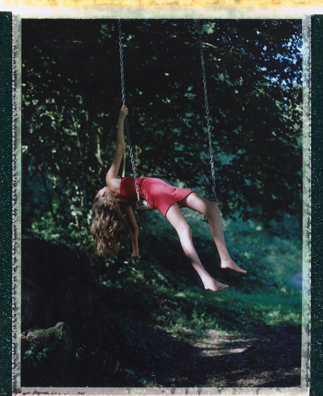 Cristina Fontsare Portrait Photograph - I swing to see the world upside down - Contemporary, Childhood