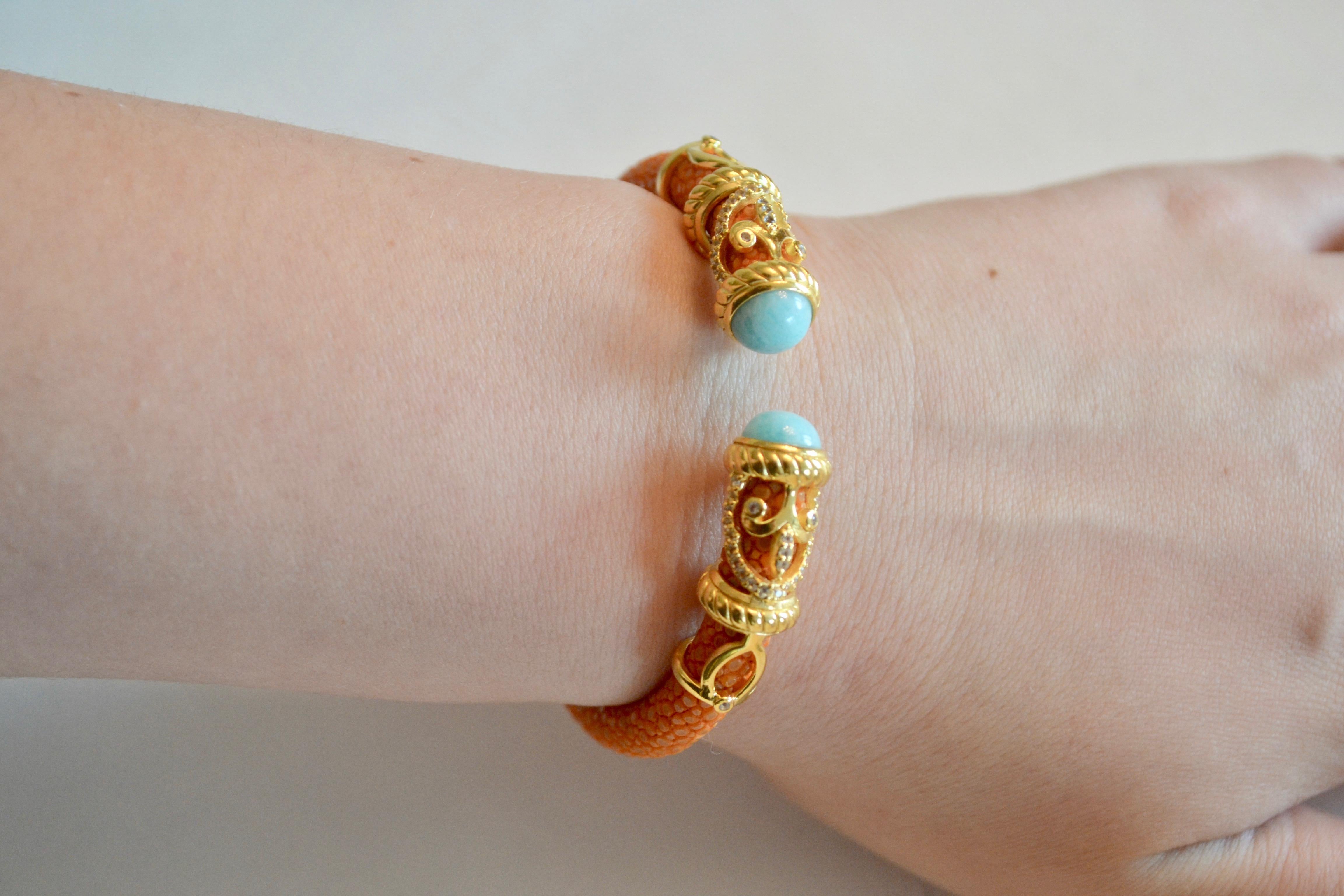 Coral stingray bracelet with Amazonite stones and gold plate scroll detailing from Cristina Sabatini. 