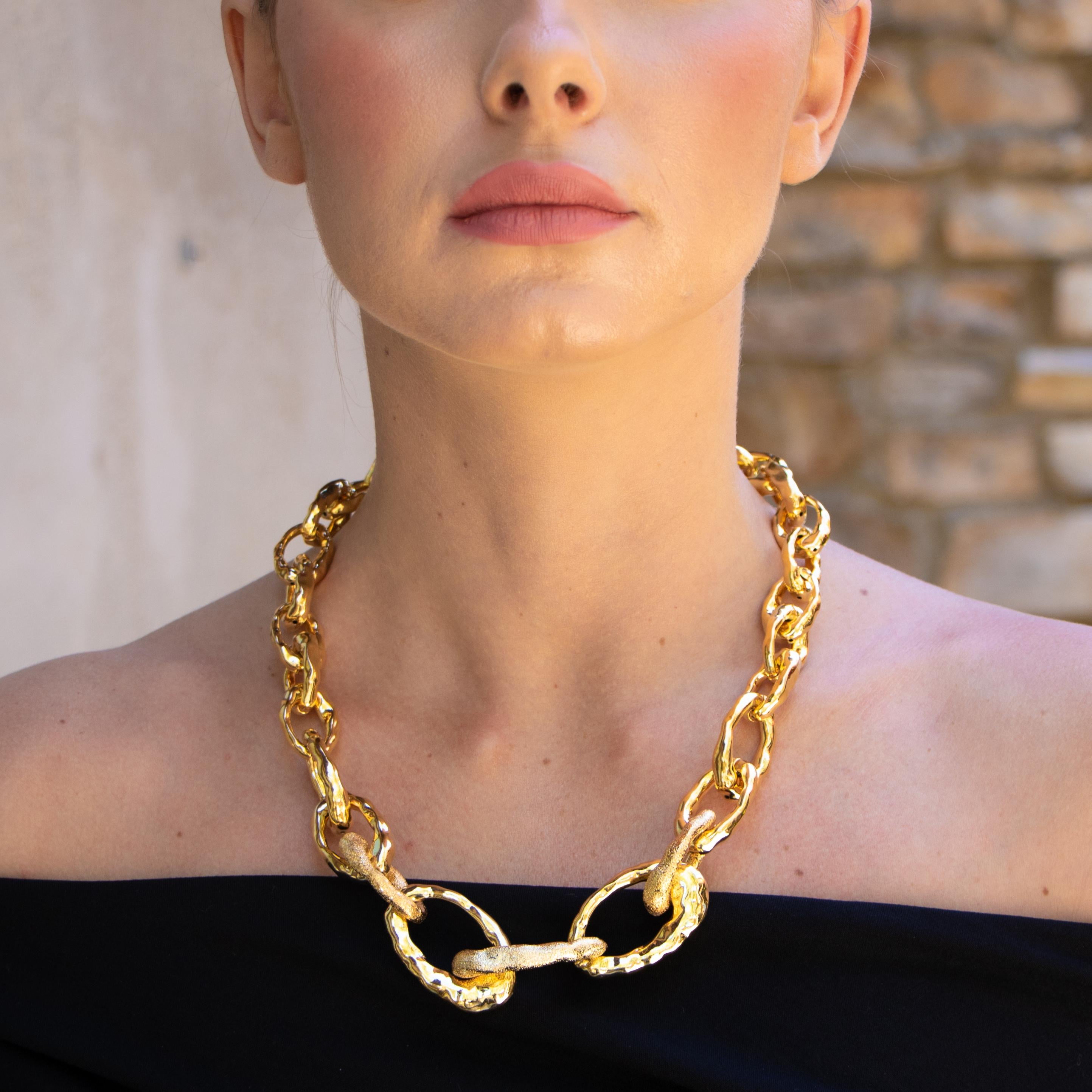 Beautiful golden necklace with textured hoops and smooth hoops. This will be a favorite and will be well loved by all. 
Designer: Cristina Sabatini
18K Yellow Gold Infused Plating on Base Metal
Length: 18-22 Inches
