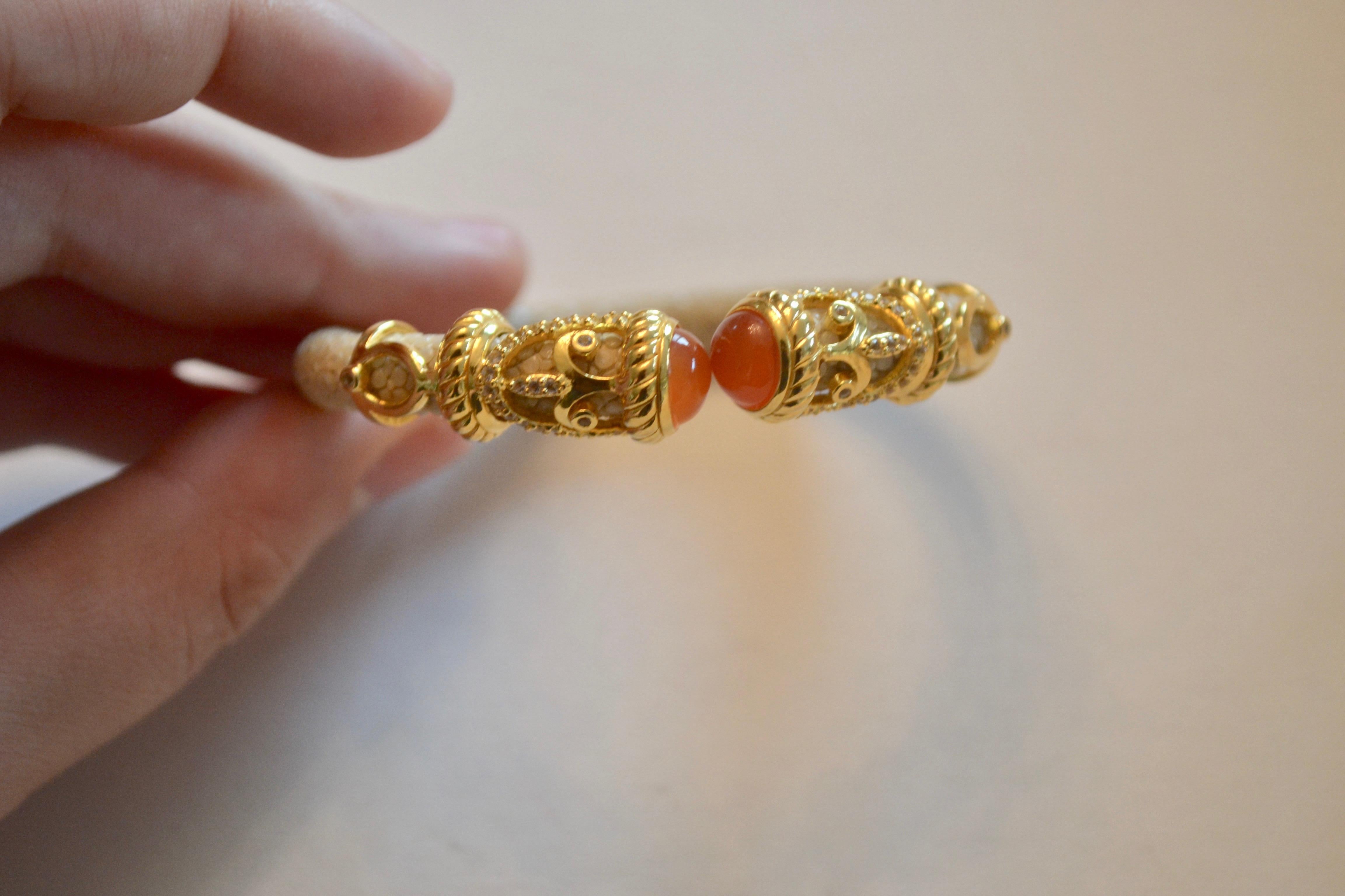 Natural stingray and carnelian stone bracelet with gold plate scroll detailing from Cristina Sabatini. 