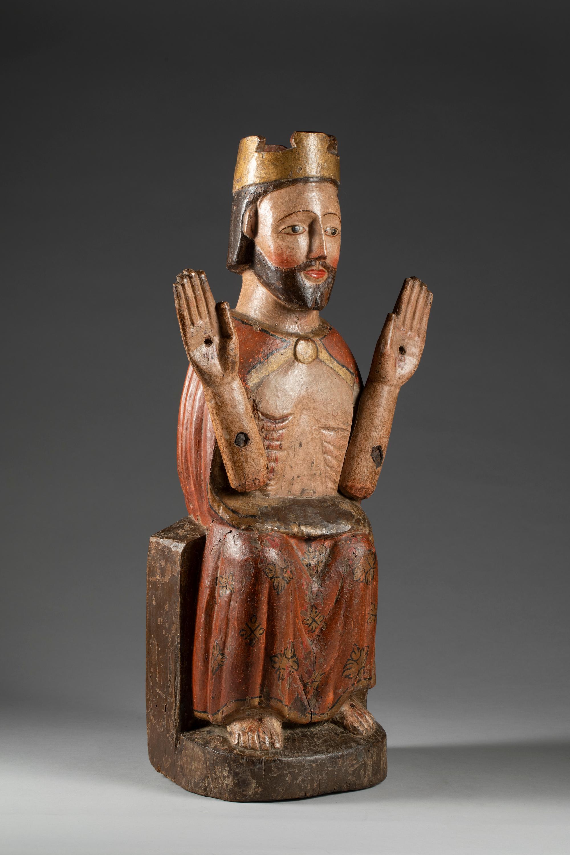 Christ enthroned

South America, 17th century

cm 64x22x18,5

Polychrome wooden sculpture representing Christ, wrapped in a red cloak edged with gold, who, crowned and seated on a throne, shows the stigmata of the hands of the feet and the wound of
