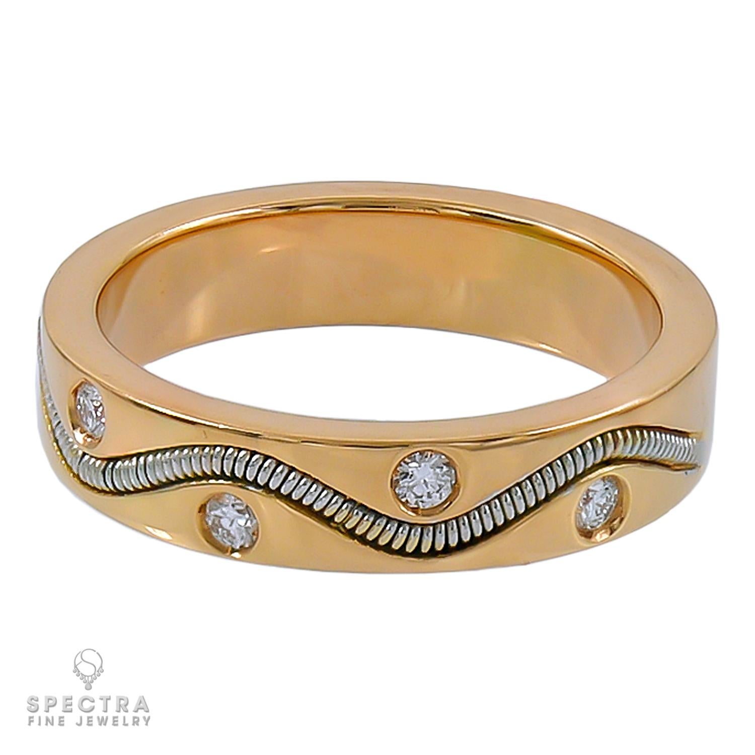 This elegant Crivelli ring, crafted in 18K rose gold, features a captivating spiral design that exudes modern sophistication. Accented with nine sparkling diamonds, totaling approximately 0.18 carats, the ring brings a touch of refined brilliance to