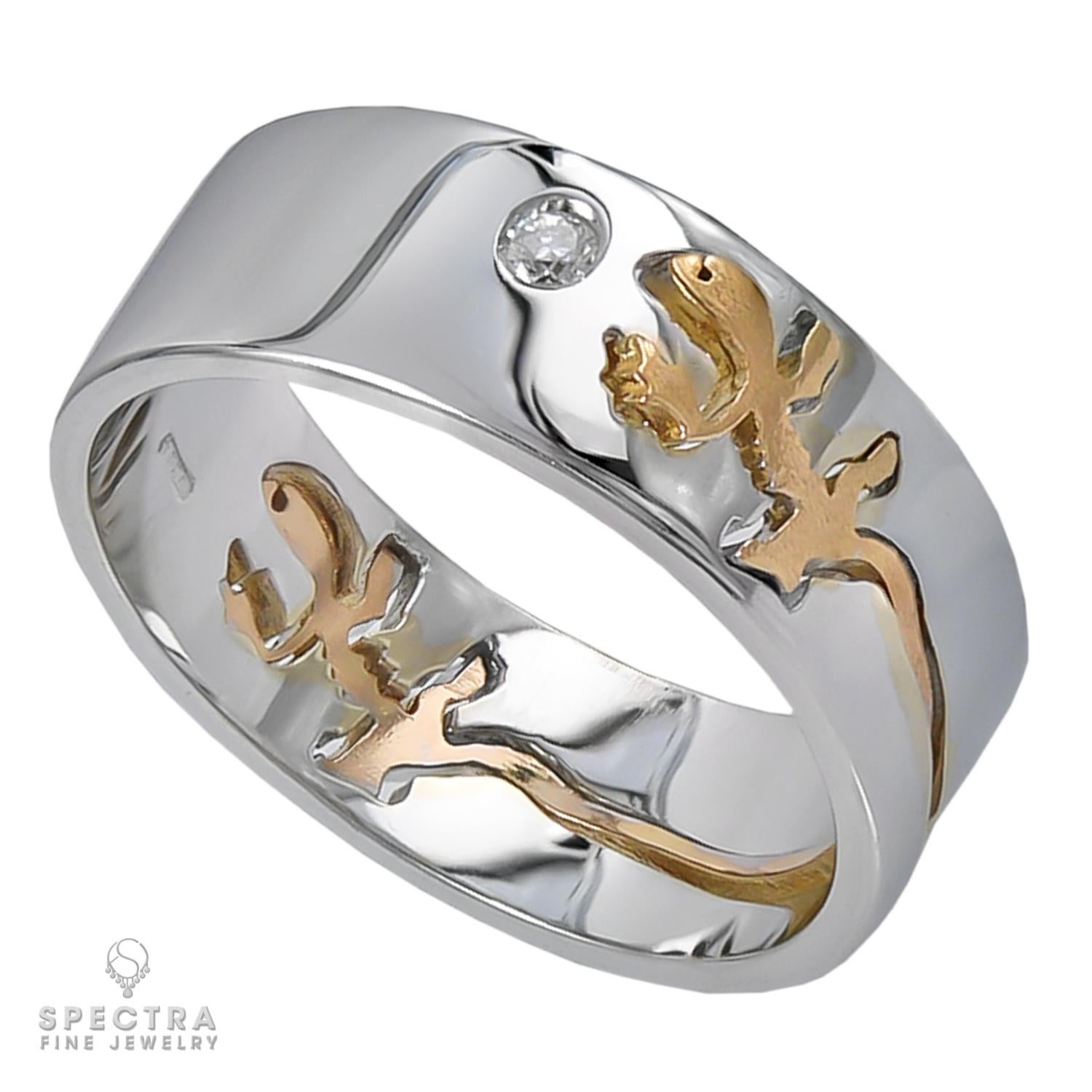 A band ring made by Crivelli in Italy in 18k white gold with a yellow gold Salamander design and two round diamonds.
Weight of diamonds is approximately 0.07 carats.
Retail price: $2,850
Gross weight: 8.4 grams
Size: 8.5.