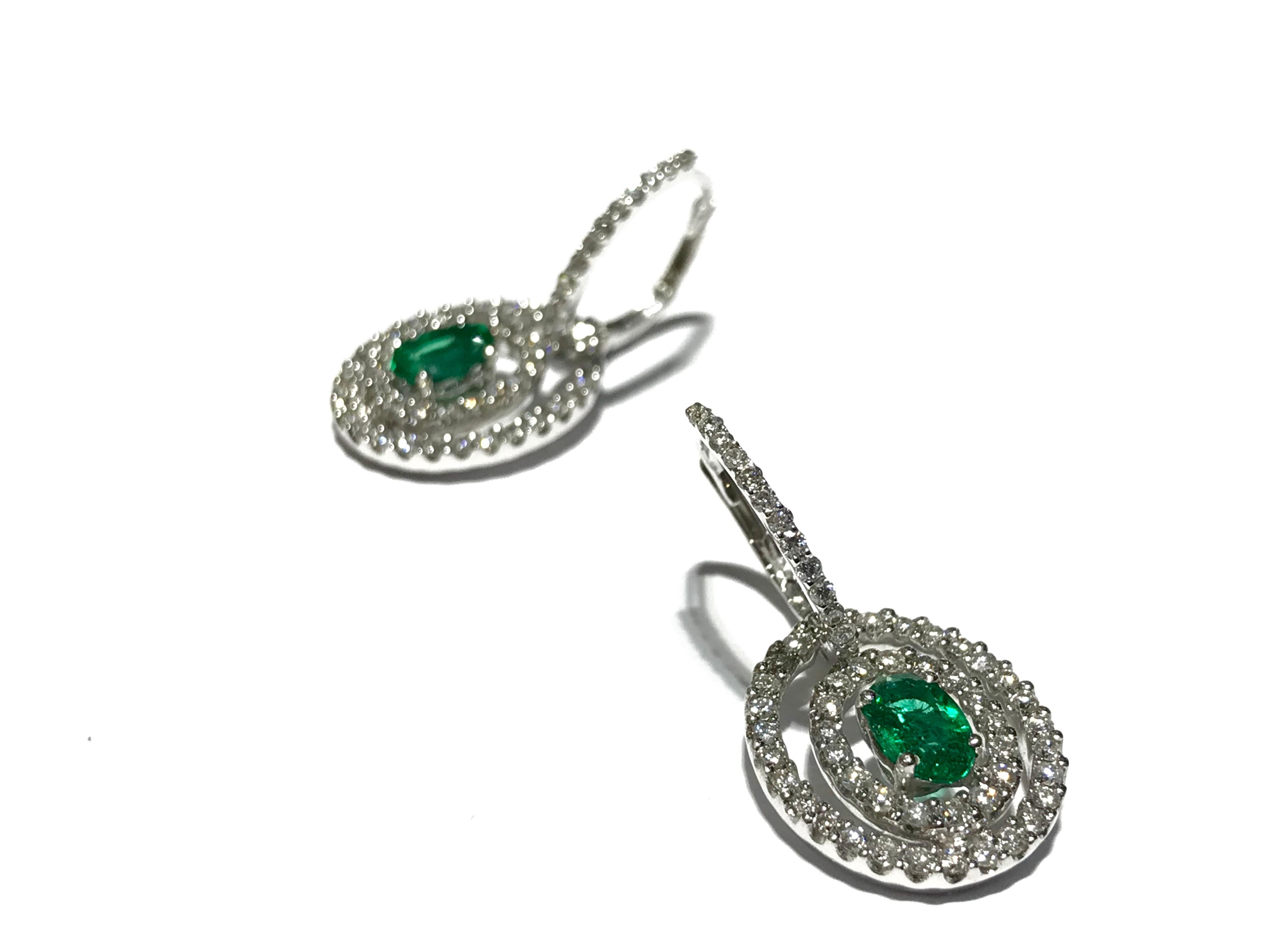 Crivelli Emerald and diamond Earrings drop style in 18 karat white gold 
1.18 carat diamonds 
0.80 carat Emeralds 
drop loop Earrings 