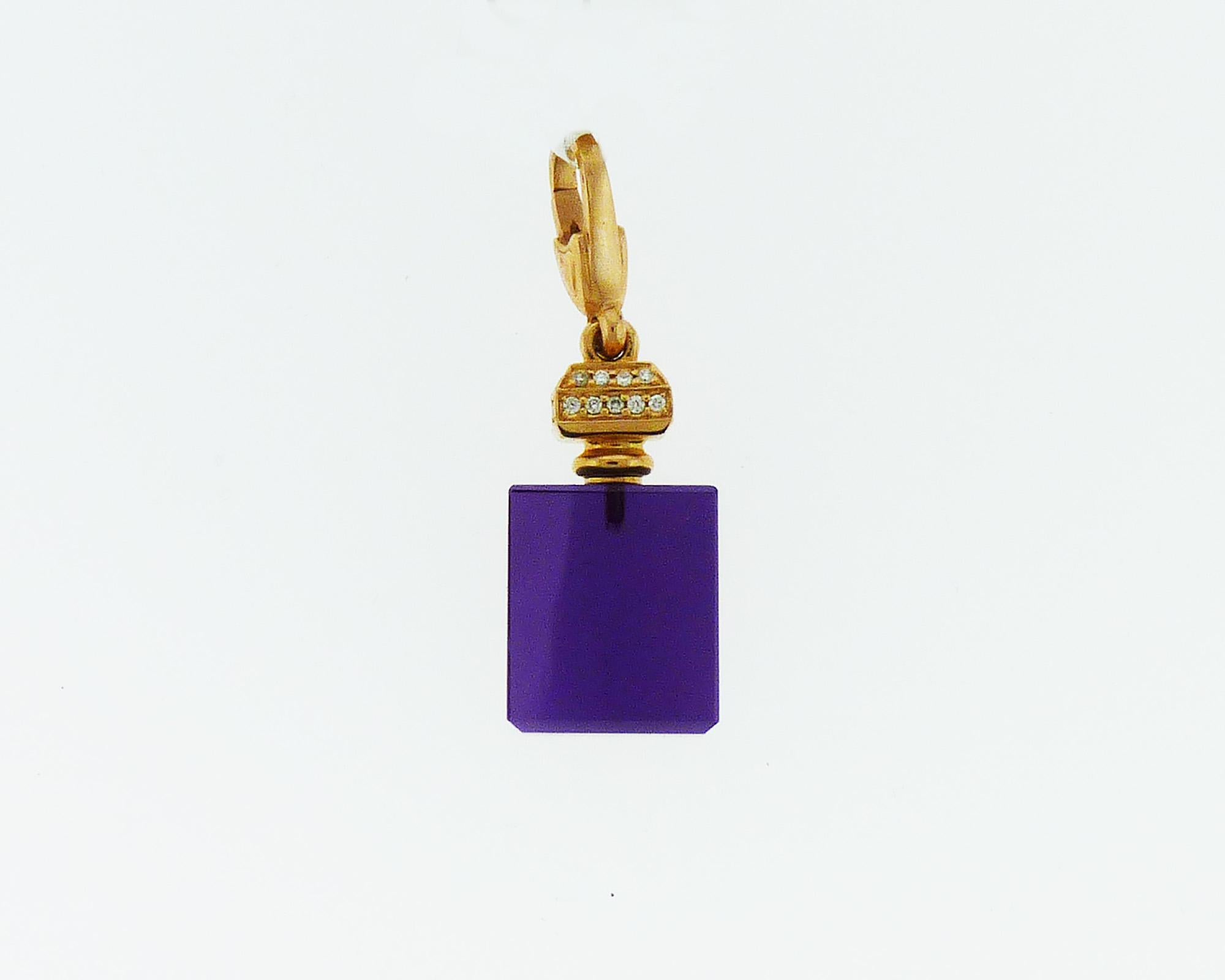 A necklace pendant in the shape of a perfume bottle available in different colors - purple, pink, yellow and blue. Made of quartz, 18K yellow, rose or white gold and embellished with white diamonds.
The cord is NOT included.
The pendants are sold