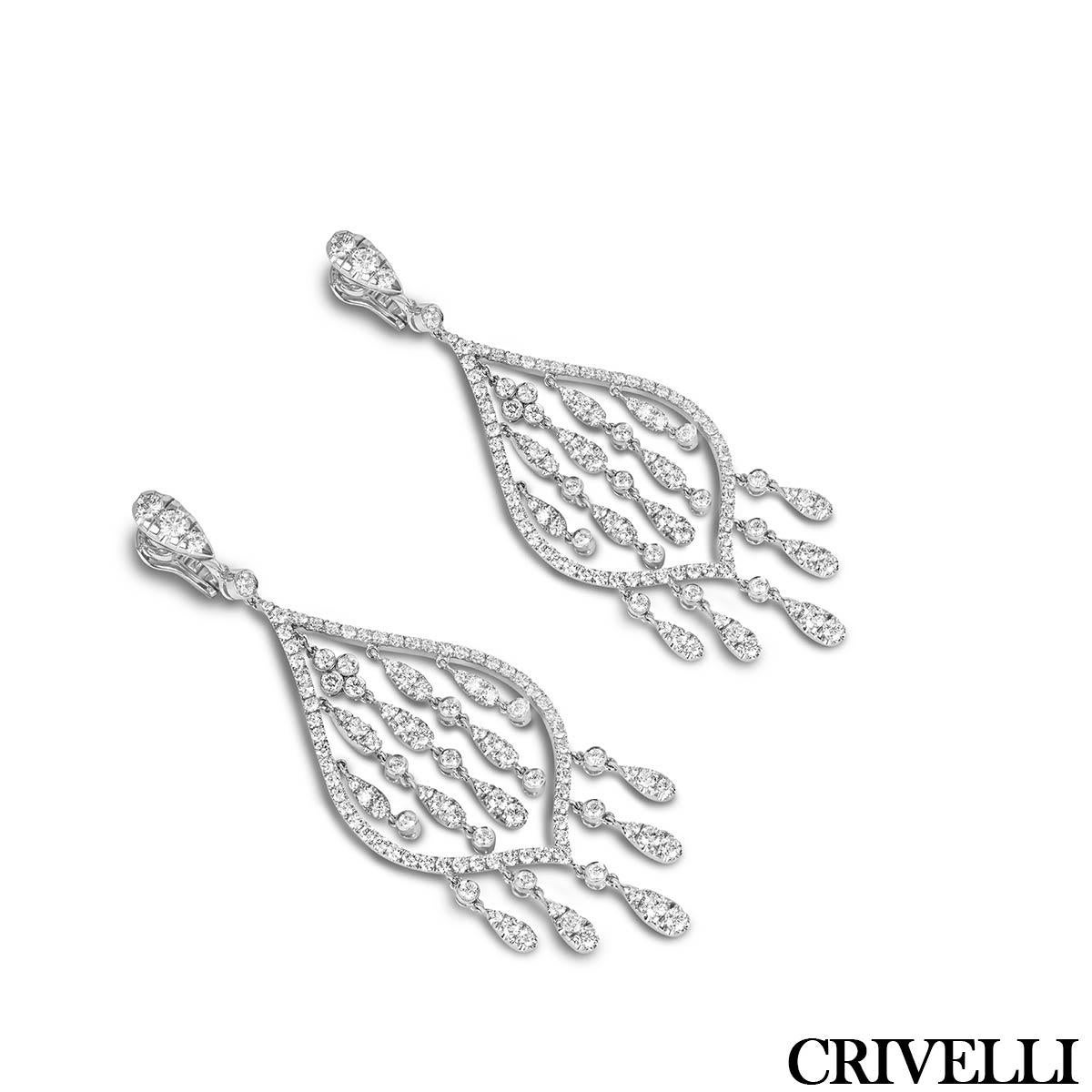 A magnificent pair of 18k white gold diamond earrings. The gorgeous chandelier design earrings are each adorned with 111 round brilliant cut diamonds with an approximate total weight of 7.30ct, E-F colour and VVS-VS clarity. The centre and bottom of