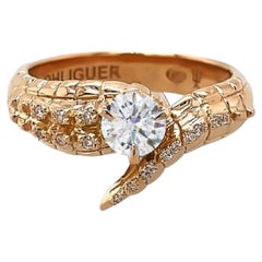 Anello con coda di coccodrillo e diamante rotondo taglio Brilliante in oro rosa 18 ct.