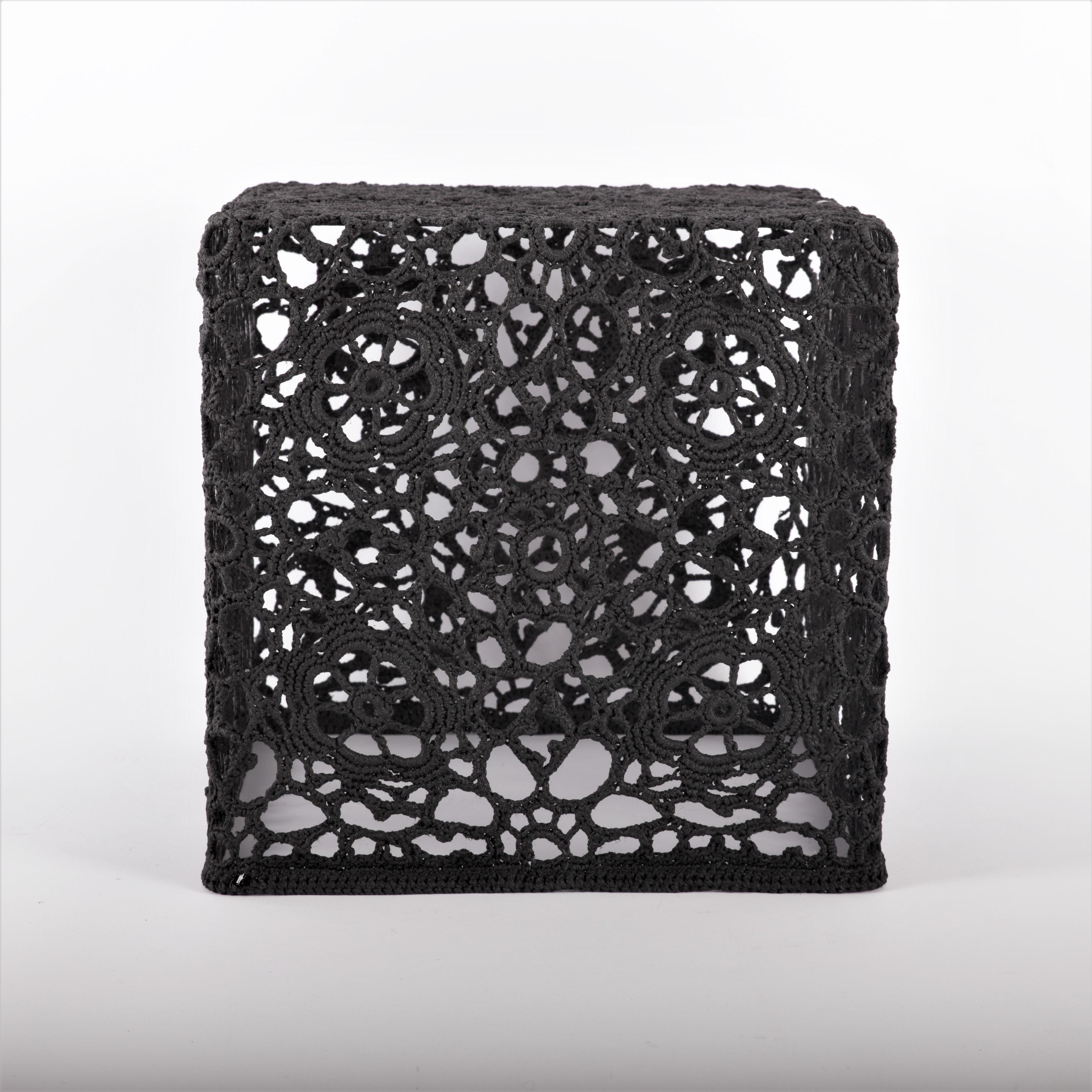 Crochet side table, special black version of 30x30x30cm, designed by Marcel Wanders, 2007, of which we have a few pieces available. 

Inspired by the earlier Lace Table (1997), the Crochet Table (2001) uses crochet material to create a more robust