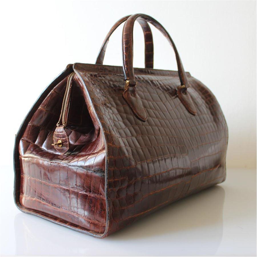 Vintage 50's Period Real crocodile Brown color Two handles Zip closure Two internal large zip pockets Cm 49 x 34 x 25 (19.2 x 13.38 x 9.8 inches) Good conditions considering the age
