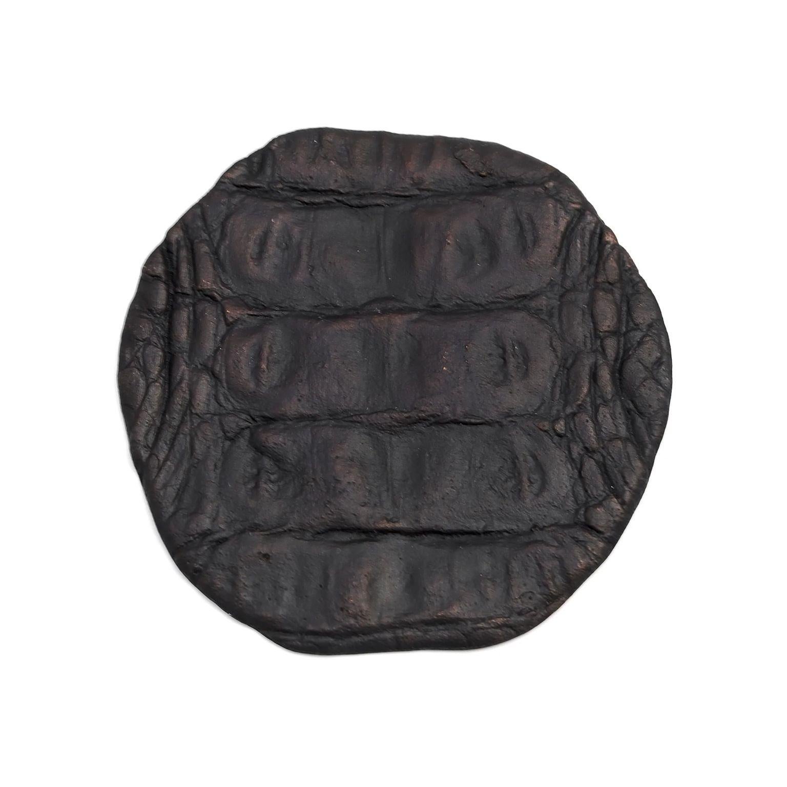 Crocodile coaster 2 by Fakasaka Design
Dimensions: W 11 cm D 11 cm H 0.6 cm.
Materials: dark bronze.
Also available in polished bronze.

CROCODILE COASTER 2 CUP COASTER / BOTTLE COASTER / CANDLE TRAY 

 FAKASAKA is a design company focused on