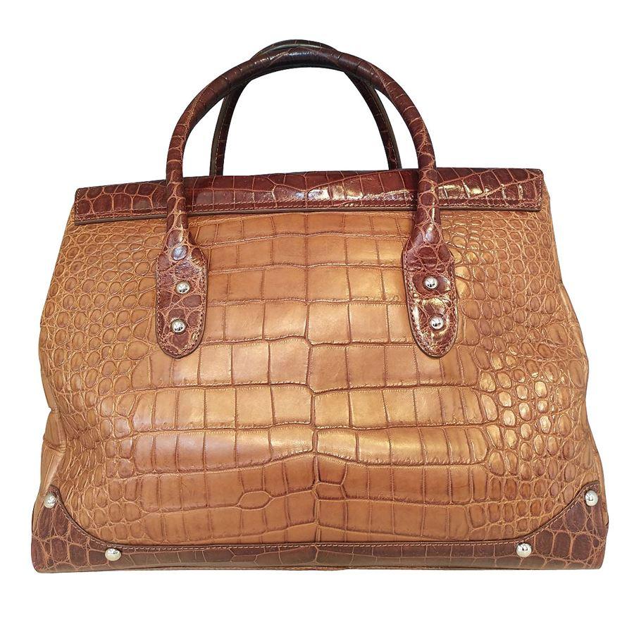 Real crocodile Beige and brown color Two handles Metal closure with keys Cm 35 x 28 x 15 (1377 x 1102 x 590 inches) With dustbag Presence of few spots on the outside see pictures Original price euro13500
