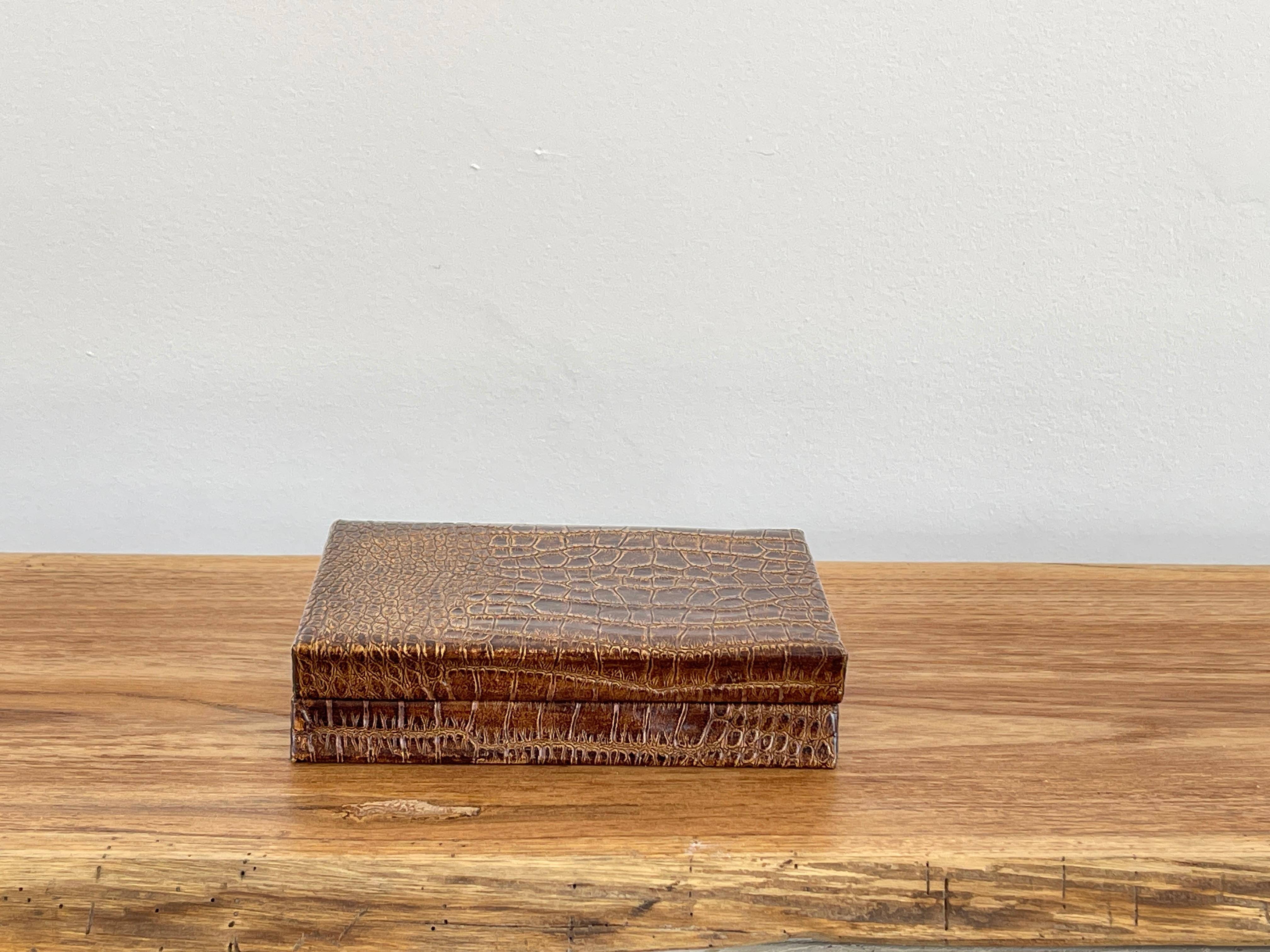 Wood covered cigar box in crocodile leather
Great patina and gift!
France, 1960's.
