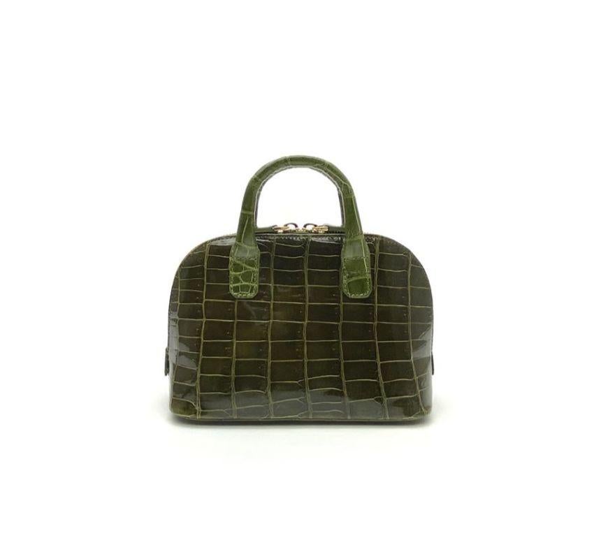 Real crocodile or alligator leather Olive green color Double handle Hand painted sides Internal pocket External pocket Removable shoulder strap Cm 195 x 14 x 85 (7.67 x 5.5 x 3.34 inches) Artisanally made in Milan Italy Comes with CITES