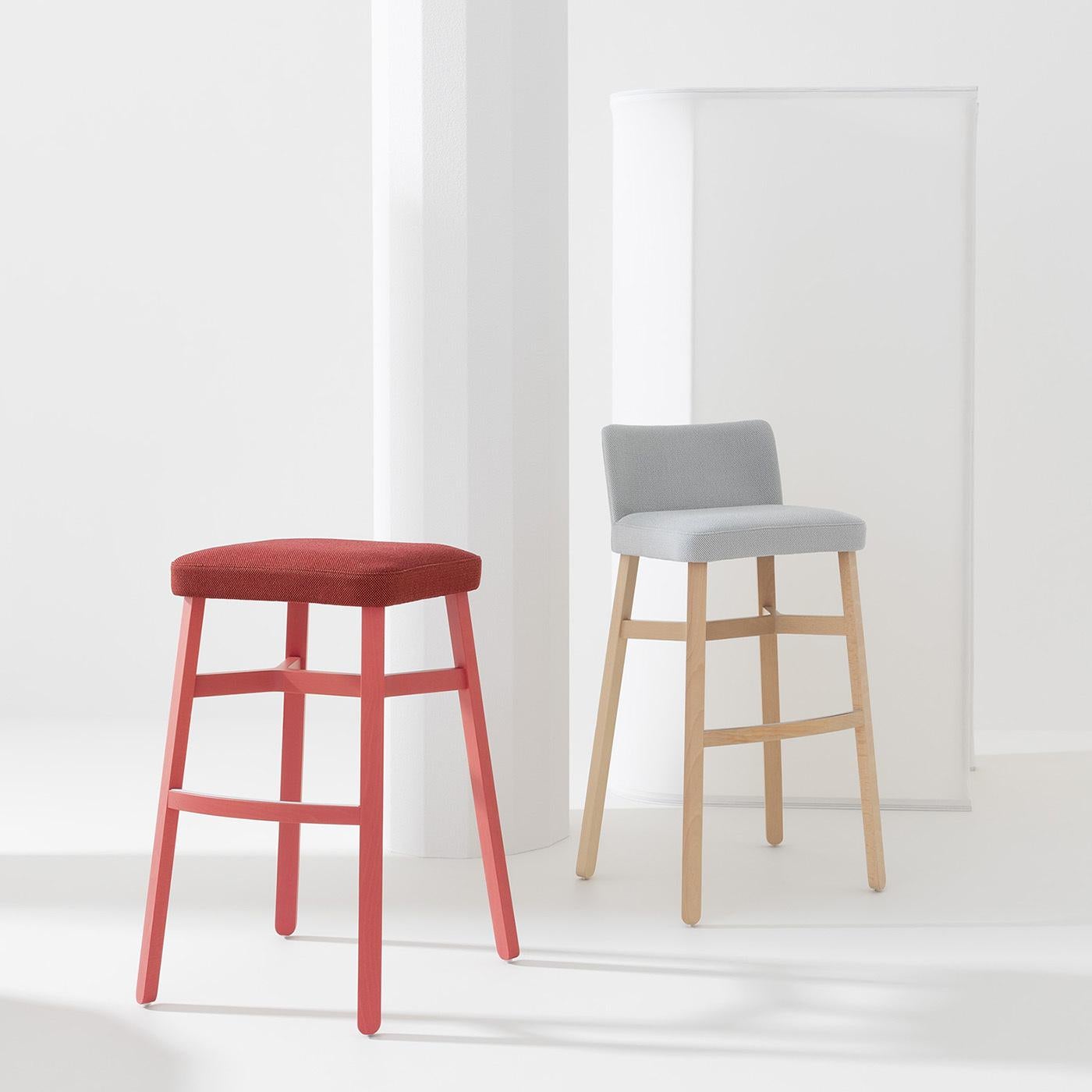 This superb stool by Emilio Nanni balances the liveliness of vibrant colors with an exquisitely modern aesthetic. Showcasing the distinctive trait of the Croissant Collection - the structural crossing under the seat - this piece features a slender