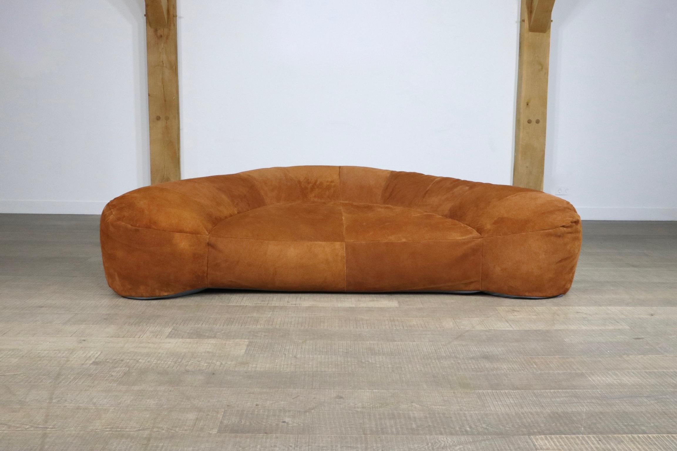 Incredible and rare croissant sofa in suede by Raphaël Raffel for Maison Honoré Paris, 1970s. This sofa, which was made to order from the 1970-1980s is besides its iconic design famous for its extremely high comfort. The stunning cognac suede is